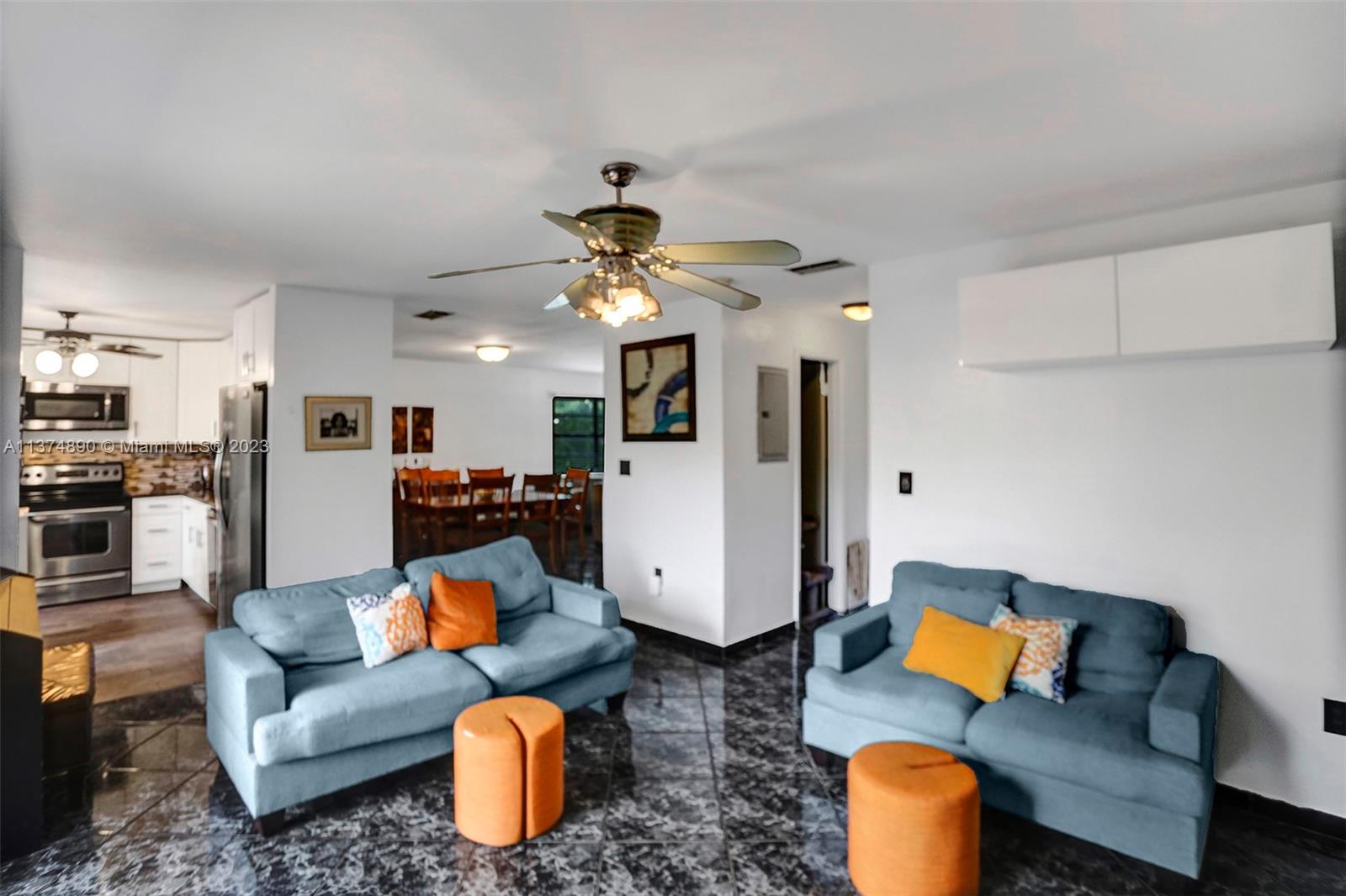 View from the family room with the kitchen and dining rooms in the background.