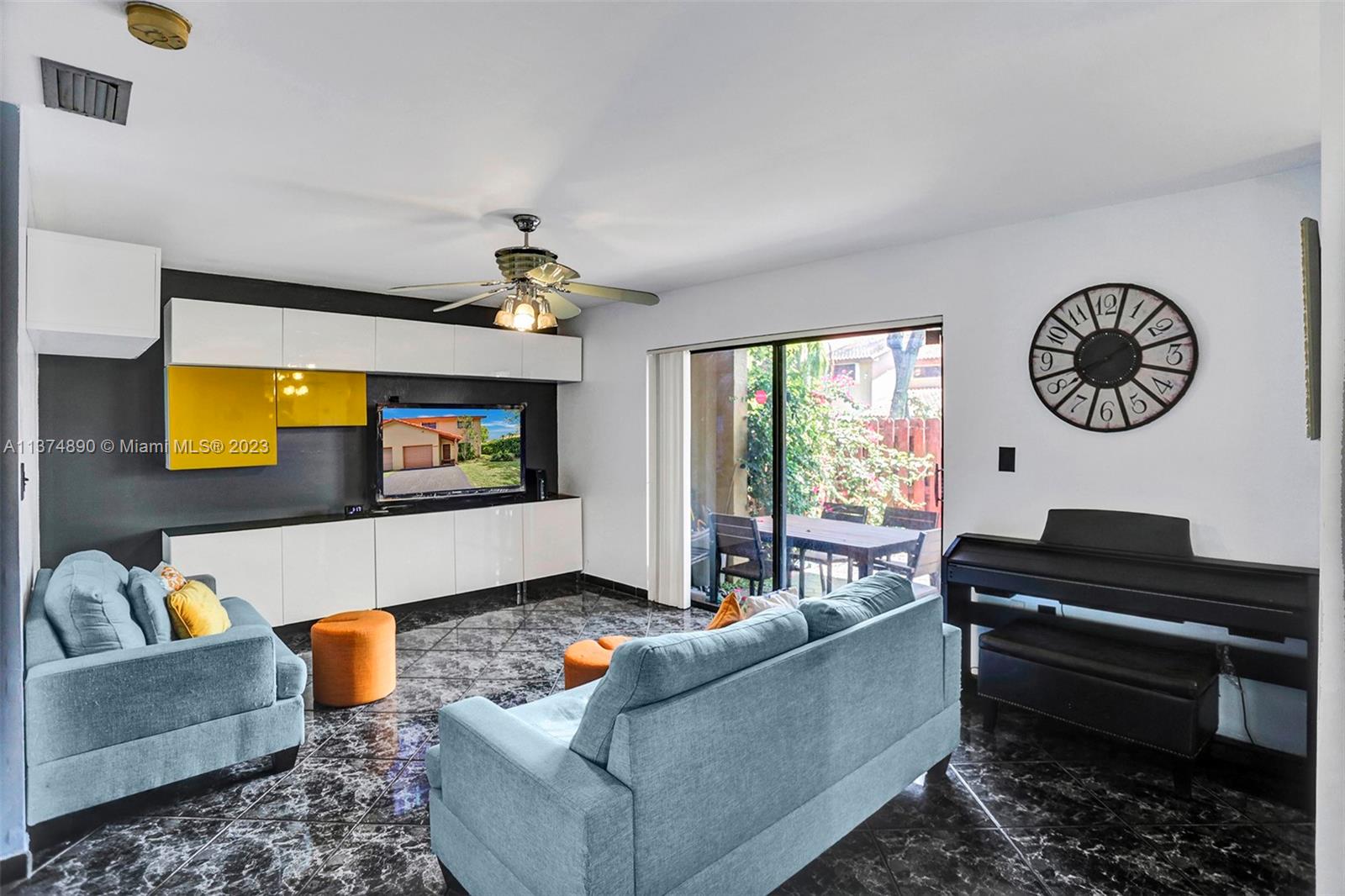 Family room with custom built-ins which will stay.