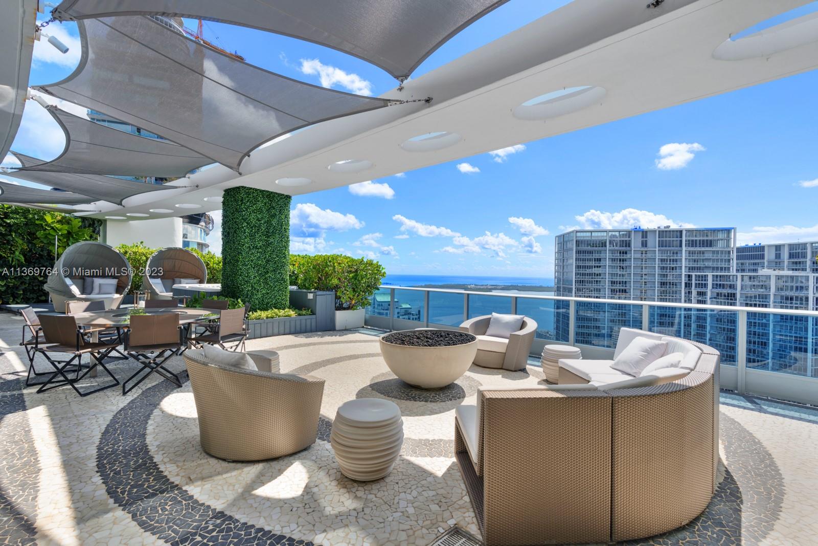 Located on the 54th floor of the Epic Residences in Downtown Miami, this completely custom 2-story Penthouse offers breathtaking South East views of the bay and Brickell’s city skyline from an expansive deep balcony with 4 bedrooms, 5 full and 1 half bath. The open floor plan flows through with wide views from the Kitchen with cooking island, Miele and Subzero appliances, and pantry. Split floor plan offers ultimate privacy for the one of a kind Master Suite with sitting area. Indulge in easy entertaining from the 2nd floor dining room / media room, gym and oversized terrace with hot tub and summer kitchen. Top of the line finishes throughout including wooden floors, electrical blackout shades and built-out closets. 2 assigned garage spaces included.