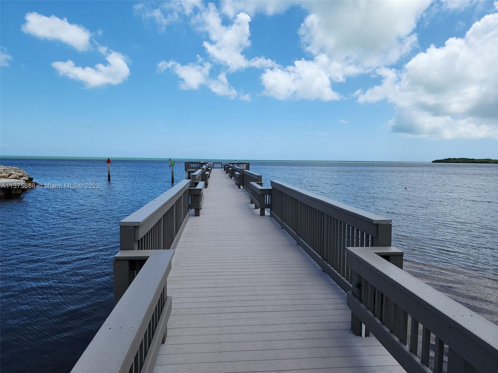 Spectacular Key Largo Ocean Resort Community brings you paradise in the Florida Keys. This vacant land is located in a newly built development and is approved for a residential home construction of up to three levels including a terrace with a covered rooftop. AMENITIES Include: Secured gated entrance, amazing marina with boat slips, boat ramp, pier, large pool w/ generous deck area, tennis courts, basketball court, kids play area, splendid club house available for entertainment and gatherings. Come and build your "Dream Home" in the heart of Key Largo. Mile Marker 94.8. Resort is near dinning, supermarkets and schools.  Come Home to Key Largo Ocean Resort and Live Well!!