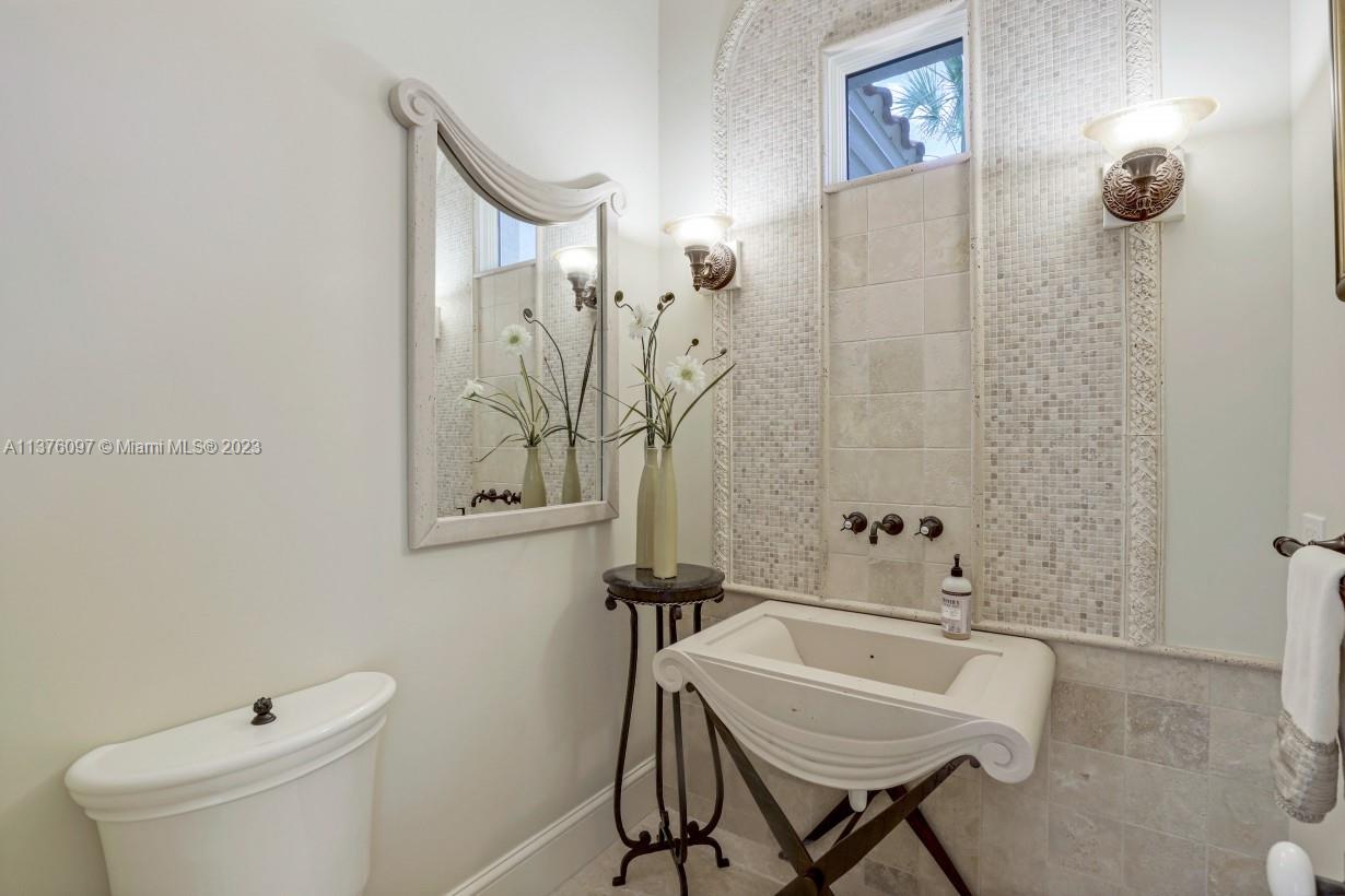 Elegant Powder Room just off entry lobby