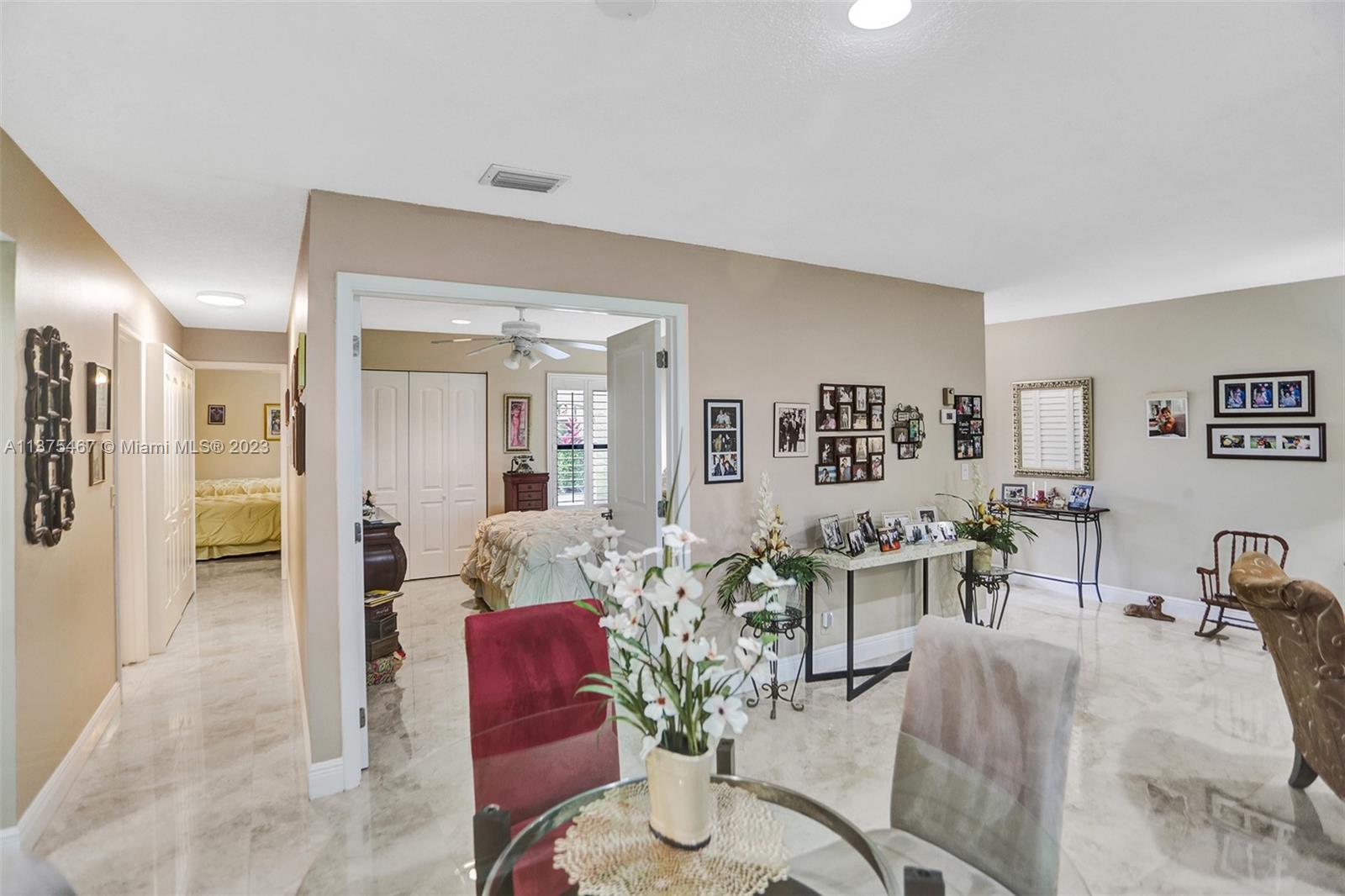 View of the Dining Area plus view of Bedroom 2 which can be also a Den or an Office, Hallway view to Master
