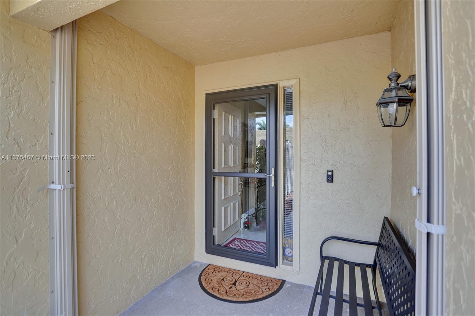 Front Door View & Open Front Porch-Accordion Shutters Protection