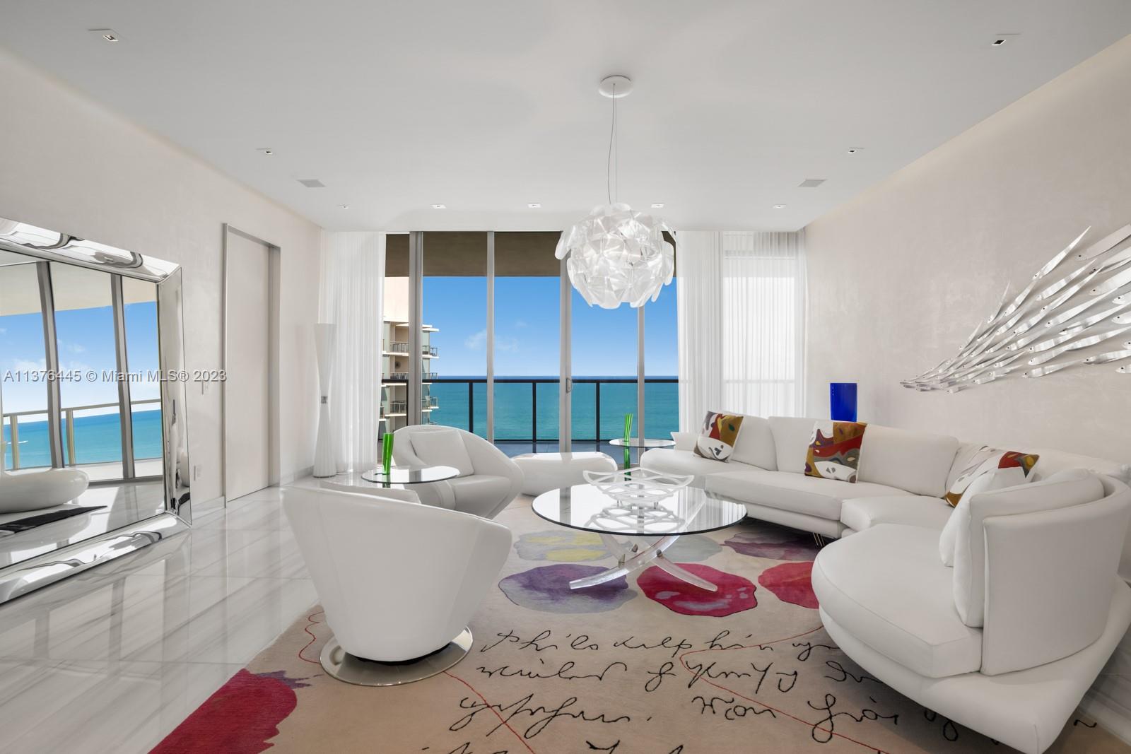 Introducing the Lower Penthouse at the highly sought after St. Regis Bal Harbour. This stunning unit offers breathtaking panoramic ocean views, with floor-to-ceiling windows that flood the space with natural light. Experience an open floor plan that seamlessly blends indoor &amp; outdoor living. The fully equipped kitchen is complete with top-of-the-line appliances, custom cabinetry, &amp; a large island. The adjacent dining area offers plenty of space to gather &amp; take in the breathtaking Miami skyline. Residents can enjoy unparalleled amenities, including a spa, fitness center, pool, beach services, &amp; 24-hour concierge &amp; security. Just seconds away from the prestigious Bal Harbour Shops, this unit offers a luxurious lifestyle that is second to none.