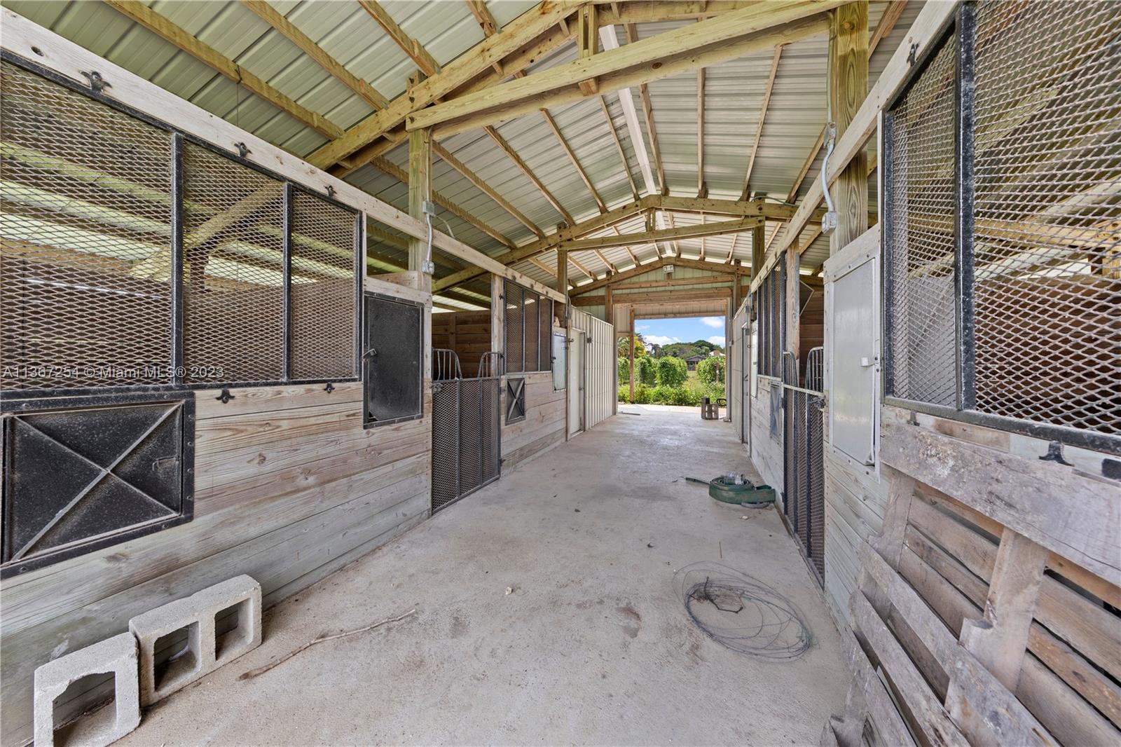 INTERIOR BARN THIS AREA CURRENTLY USED AS COOLERS .. THE PASTURE IS PLANTED WITH CROPS..