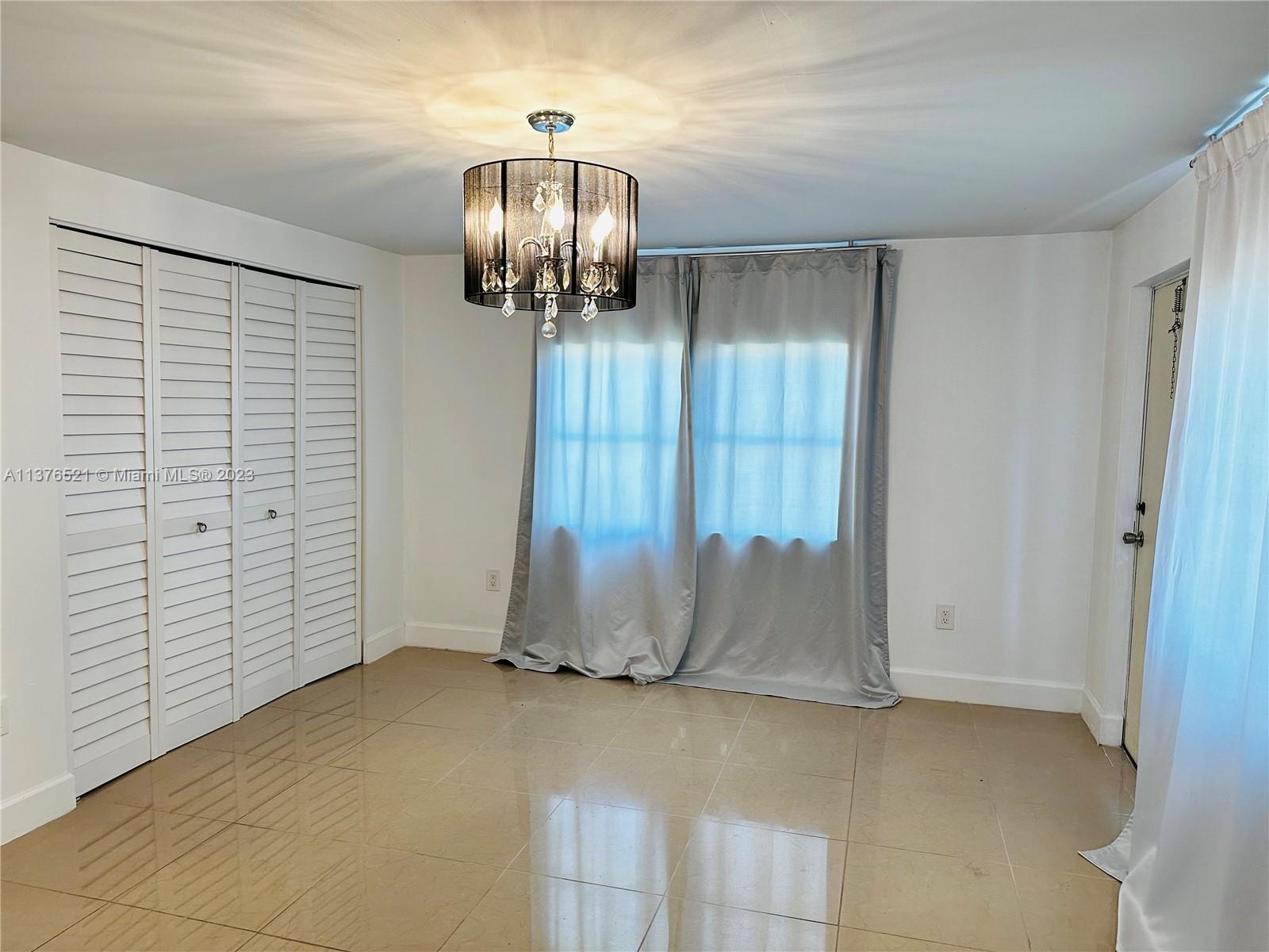 Master Bedroom with beautiful light fixture