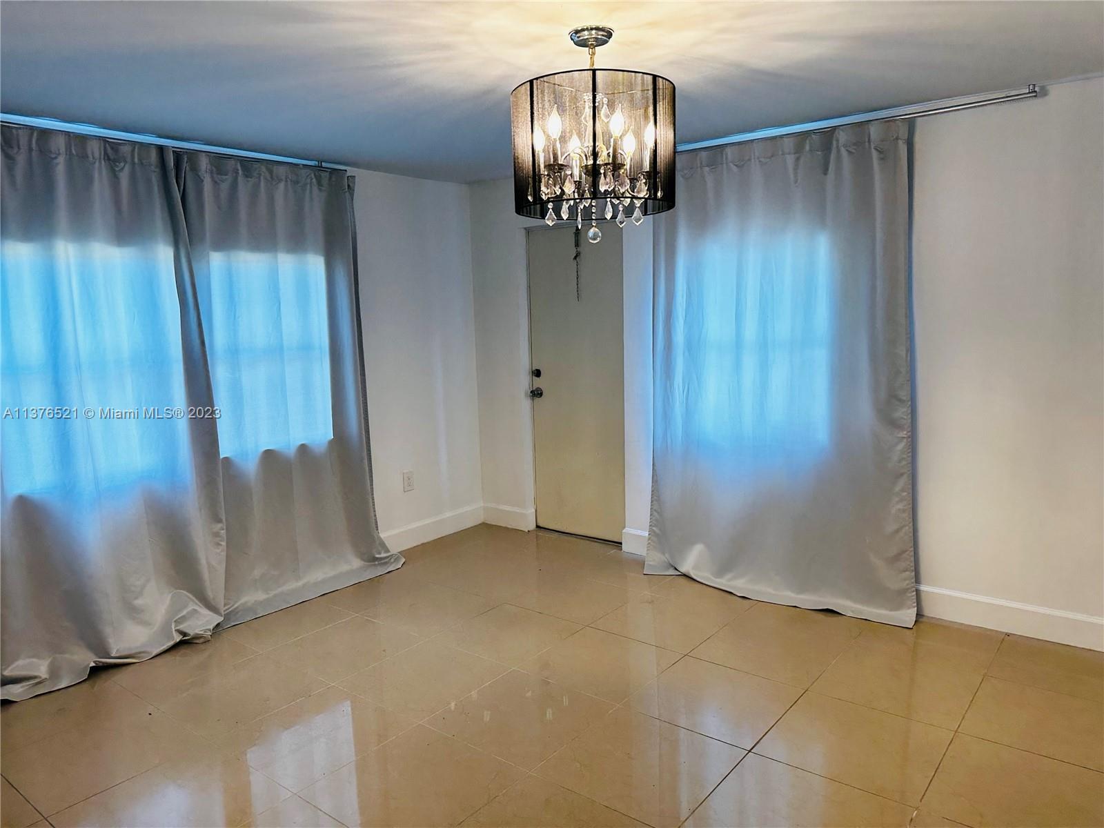 Master Bedroom with beautiful light fixture