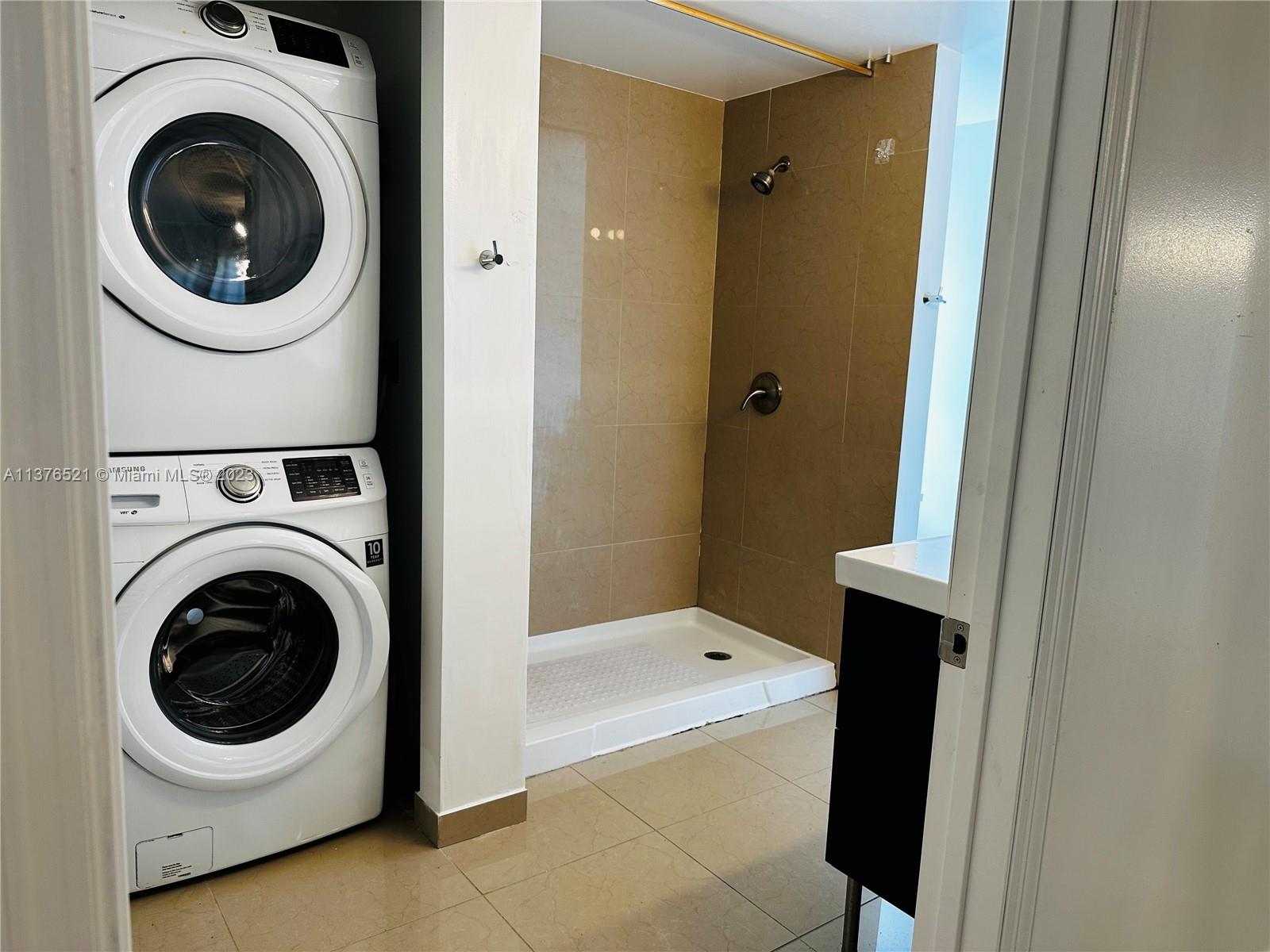 Washer & Dryer in master bathroom ft. shower