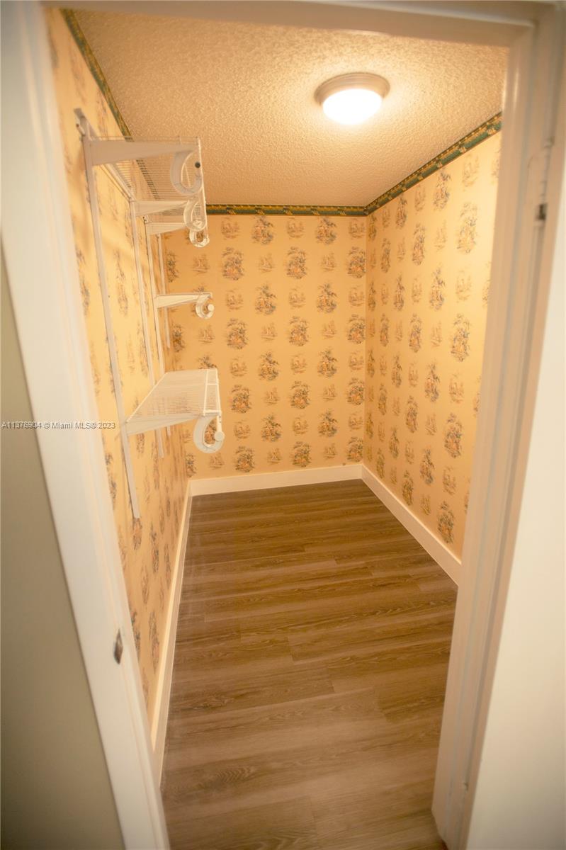 Primary Bedroom walk in closet