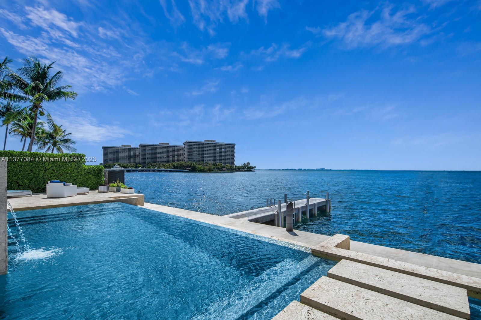Breathtaking Waterfront Estate;located in the highly sought after Coconut Grove neighborhood.Encompassing a sophisticated & contemporary design,this exquisite home was uniquely built to showcase open & airy spaces w/unapparelled open bay views.W/13,930 SF,6bd/10.5bth;including a gorgeous liv.area w/custom bar,panoramic views,notable office,winecellar & chefs kitchen.Stunning primary suite boasts massive his/her walkin closets w/elegantly distinguished baths,balcony & rooftop sundeck. Featuring extensive amenities,this all-inclusive home includes a wellness spa,craftroom,theater,gym,gameroom,1/1guesthouse,3 car garage,dock,elevator & much more.Built to entertain,w/a resort style infinity pool,swim up bar complete w/endless views.This one-of-a-kind property offers luxury living at its best.
