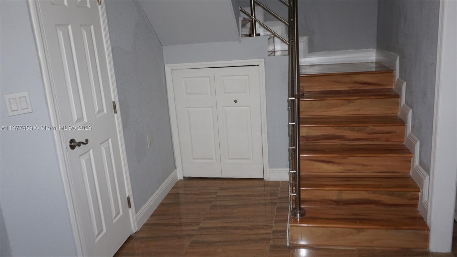 Staircase to second floor, storage and bathroom ground floor.