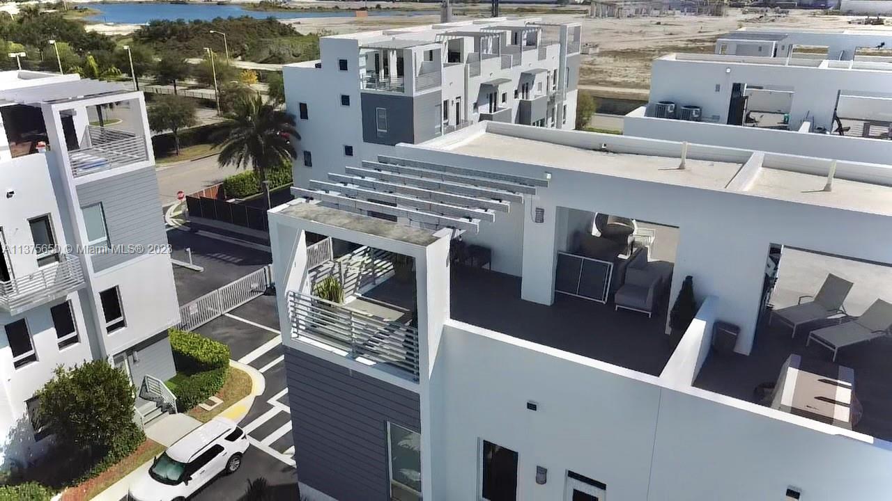 Enjoy this super spacious, contemporary CORNER Townhouse with Rooftop terrace with excellent views with a built-in summer kitchen. This 4 Beds 3.5 baths home offers all the space and comfort you need with easy maintenance. Open concept kitchen with Italian cabinetry, stainless steel appliances, and quartz counter tops. Enjoy beautiful sunsets and reunions at your private terrace and also all the entertainment of the Doral shops nearby. Additionally, it has impact windows for your protection and enclosed doubled car garage. Showings by appointment only. DU/approval required to show. Tenant occupied thru June 30/2023