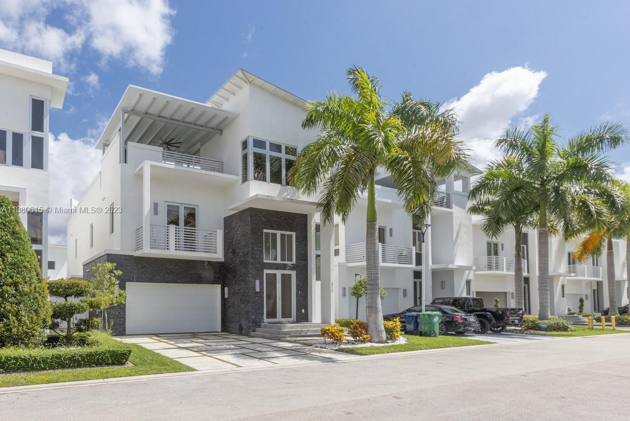 Beautiful single house property 5 bed 6 1/2 bath with minimalist architectural and modern style, high ceilings, a wine cellar, oversized master, walk in closets.  Each bedroom has it own private bathroom.  It is ready to live.  Located in the luxurious and private residence of Oasis Park Square at Doral.  It offers a unique location that is close to restaurants, shopping malls, supermakets, Miami International Airport, A+ Schools and more.  OWNER MOTIVATED!!!