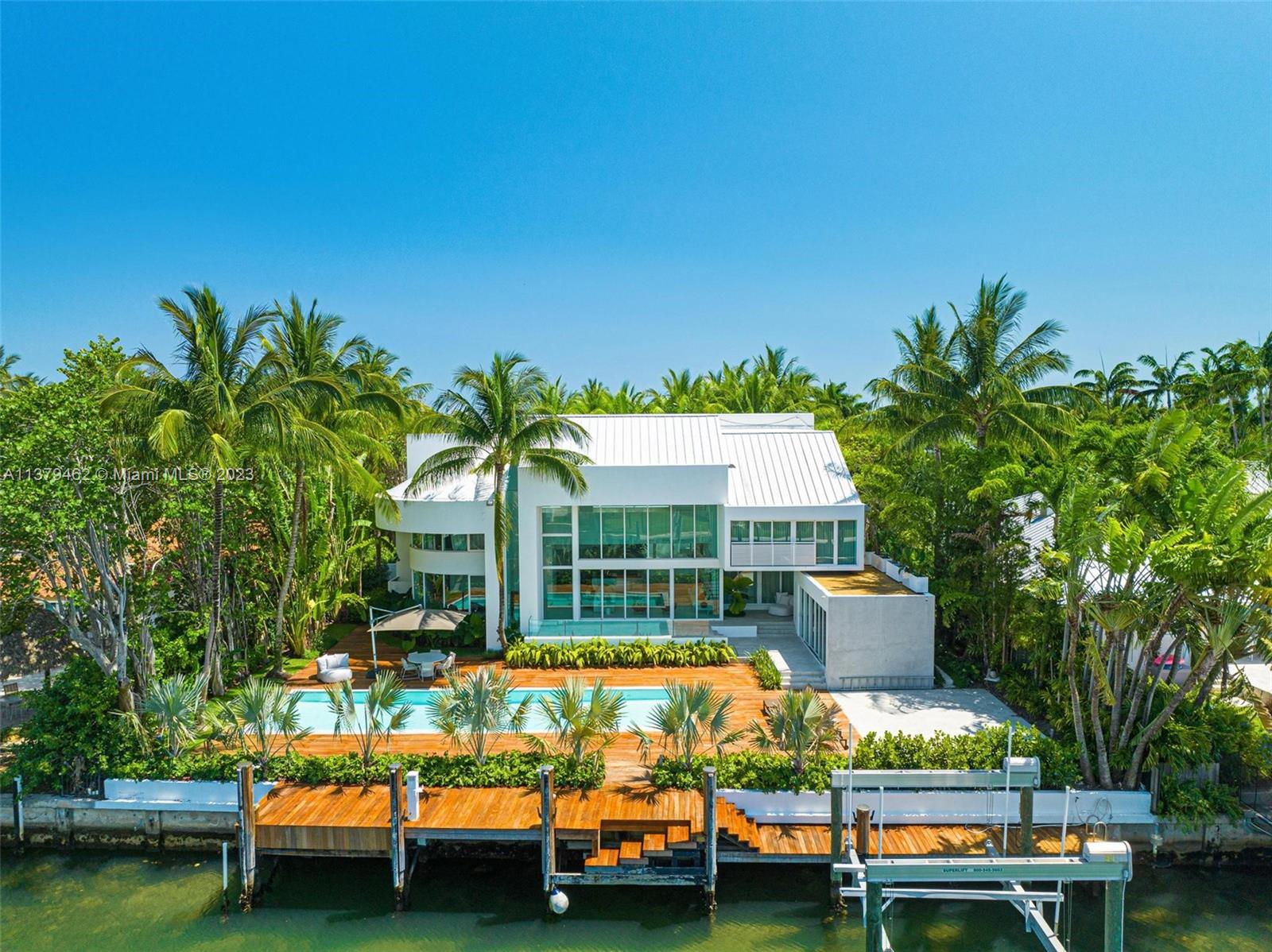 Experience luxury living at its finest in this stunning Key Biscayne waterfront home. Recently renovated to the highest standard, no expense was spared in creating this masterpiece w/ brand new bedrooms, bathrooms, flooring, plumbing, electrical, outdoor deck, kitchen & appliances. The spacious & contemporary design seamlessly connects indoor/outdoor living, providing a serene, private oasis w/ breathtaking views of the canal. Enjoy the natural light streaming through the high ceilings & floor-to-ceiling sliding glass doors. The custom lighting design adds a touch of sophistication to this exquisite home. W/ a master chef industrial kitchen, 4 ample en-suite bedrooms, gym (can be converted to a 5th bdrm), gorgeous office/den, powder room, cabana bath & boat lift, this home has it all.