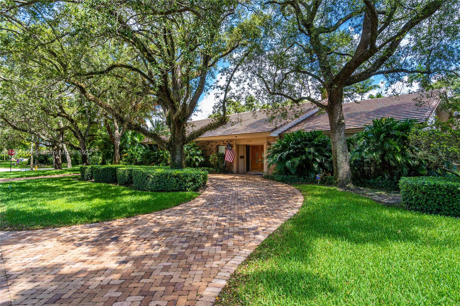 Indulge in the elegant charm of this immaculate and spacious 4/3.5 Ranch style home just 2 blocks away from exclusive Riviera Country Club.  Relish walking through tree-lined streets to the golf course, University of Miami or even a nearby park.  The brick-paved circular driveway welcomes you through French doors into a comfortable, open and gratifying interior with continuous pool views beyond the family room's full-length glass windows. This 3613 sf home affords lavish living and dining room areas and a fully remodeled kitchen with a sizable granite countertop. Owner's suite and 2 bedrooms nestled in private wing. Office, laundry room, 2-car garage, 2 zoned A/C units, whole house generator, screened pool and reflection garden, fenced area for pets and so much more!