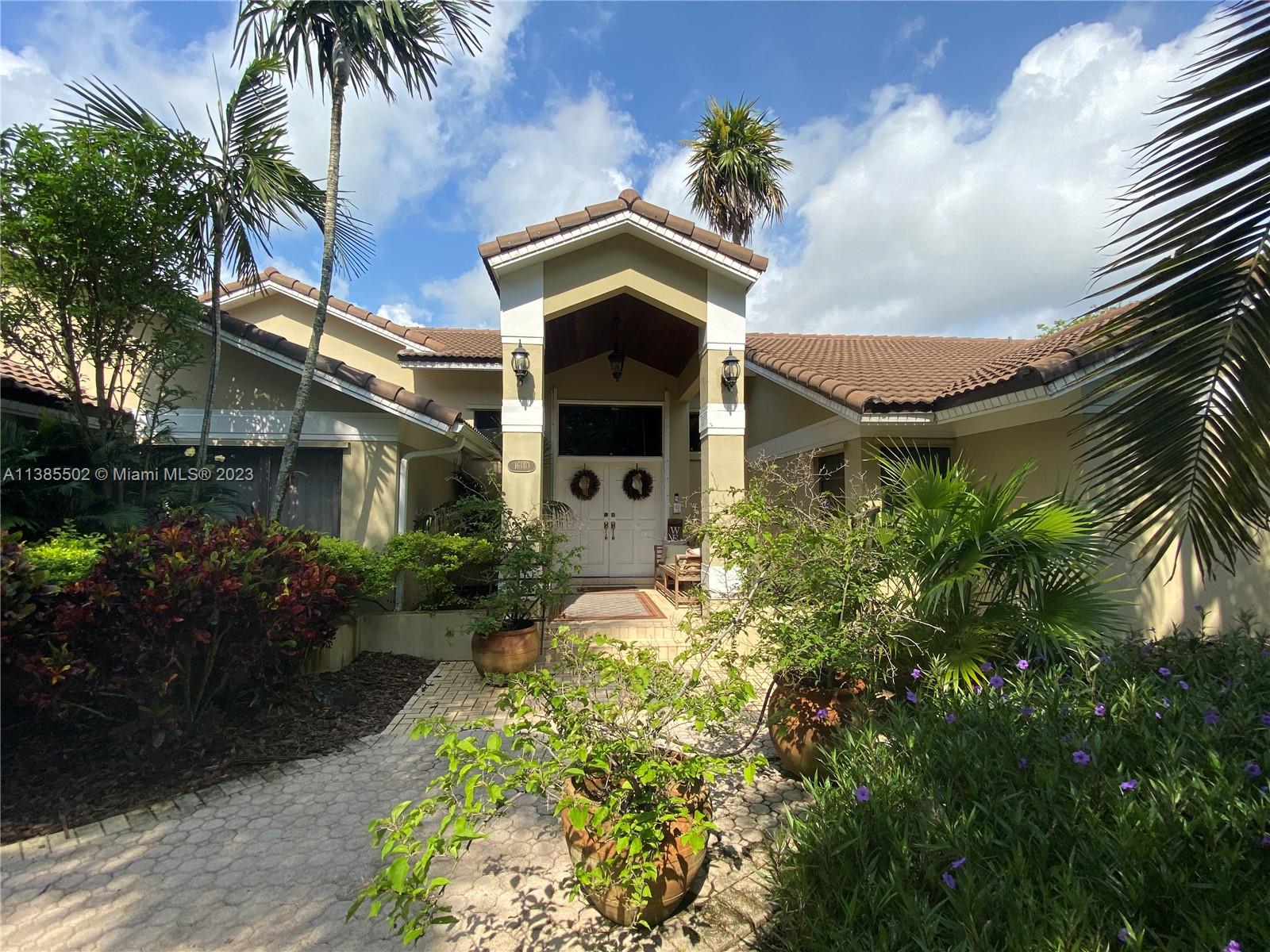 A gorgeous 5 bedroom, 3 bath home located in the sought out area of Palmetto Bay on a cul-de-sac street, it is a must see.  This stunning high ceiling home has an incredible water view, stunning fireplace, luxurious marble flooring with wood plank ceramic tiles in bedrooms.  It includes an open concept kitchen, top of the line appliances,  plus a 2 car garage.  Imagine yourself paddle boarding or a boat ride to a near by lake from right behind your home!  Home is located close to great schools, shopping and parks.  Please call agent to make an appointment.