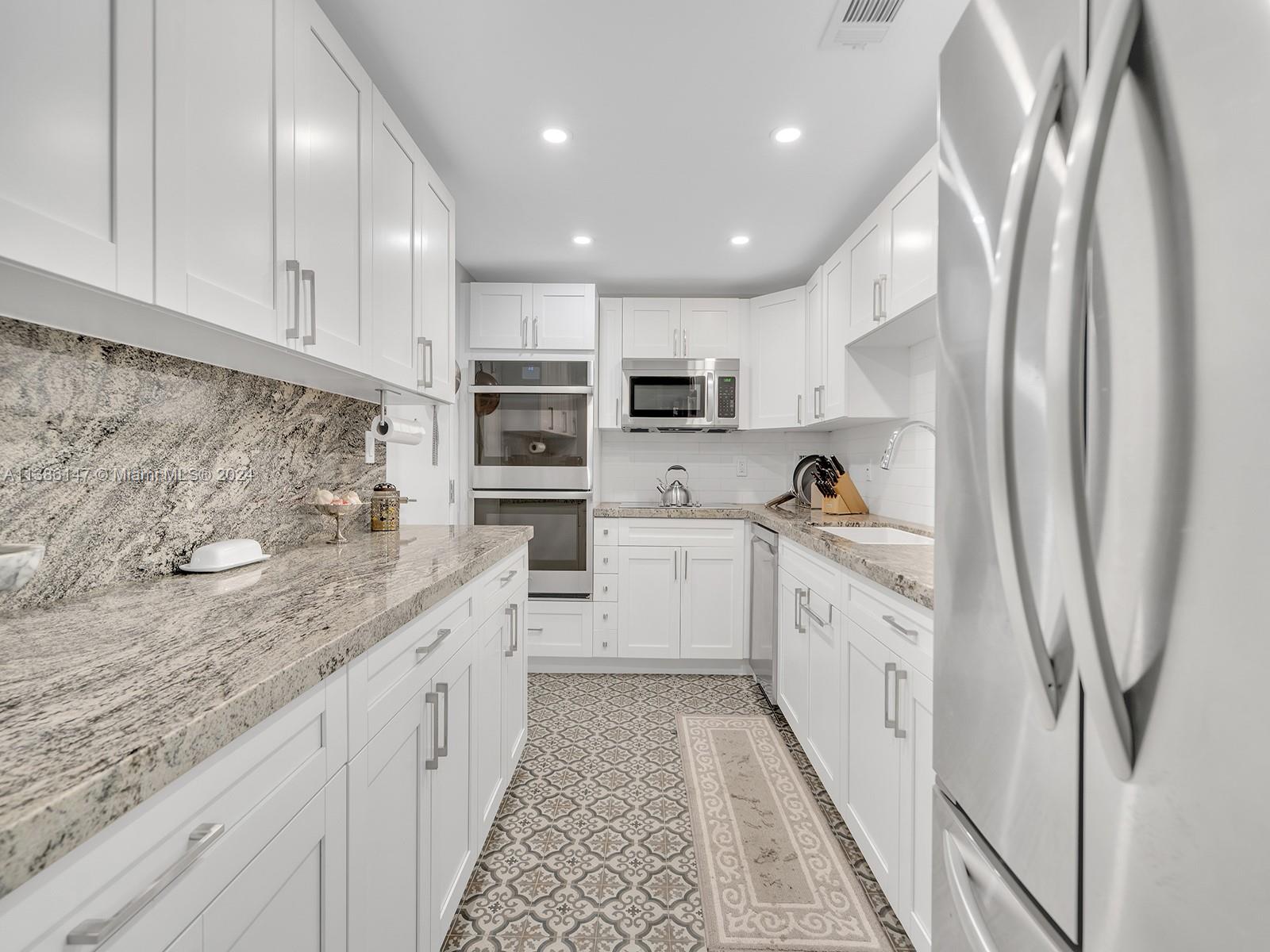 Embrace the charm & allure of the scenic Coral Gables waterway from this beautifully fully renovated unit. 2 BR/2 BA with a modern touch, this property boasts open floor plan that maximizes space & natural light. The recently updated features include a stylish kitchen with SS appliances & granite countertops, renovated baths, a spacious living area + impact windows & door. Enjoy the convenience of an in-unit washer/dryer, oversized pantry/utility closets, plus the luxury of a private patio where you can unwind and soak up the Florida sunshine. Located in a prime neighborhood 90 Edgewater offers full amenities: valet parking, doorman, concierge lobby, gym, heated pool, club/party room, community dock & on-site security. Just a short bike ride to Coconut Grove's dynamic community.