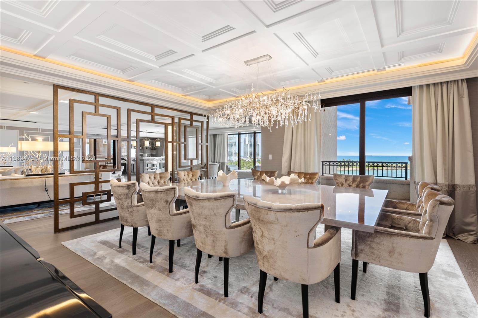 Experience the epitome of luxury living at Palazzo Del Sol—a testament to exceptional Swiss design and unmatched elegance that will exceed your highest expectations, an extraordinary 5-bed, 5.5-bath residence. With 7,302 sq ft of interior and a 2,471 sq ft terrace, this Art Deco-inspired masterpiece seamlessly connects you to the breathtaking surroundings. Meticulously crafted by Dôme, every element exudes sophistication and elegance, elevating your lifestyle. Indulge in intricate details, from exquisite cornices to mesmerizing mother-of-pearl panels, custom-designed furniture, captivating lighting and hand-painted wallpaper. Immerse yourself in awe-inspiring Ocean and Fisher Island Club views. Every aspect is curated for an unparalleled living experience where luxury meets tranquility.