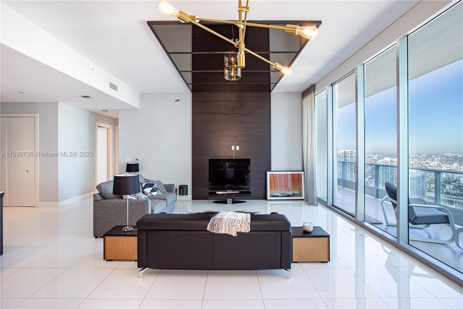 Amazing Penthouse at EPIC! Large 2 bedroom and 2.5 baths featuring gorgeous white glass floors, top of the line finishes, Miele appliances, electrical shades in every room, walk-in closets & two assigned parking spaces. Breathtaking panoramic city and bay views! Enjoy living the luxurious lifestyle in Brickell with full resort amenities and full access to to extraordinary hotel services. Shimmering reflective pools, Area 31, Zuma Restaurant, the EXHALE holistic uber-chic spa & full service fitness center.