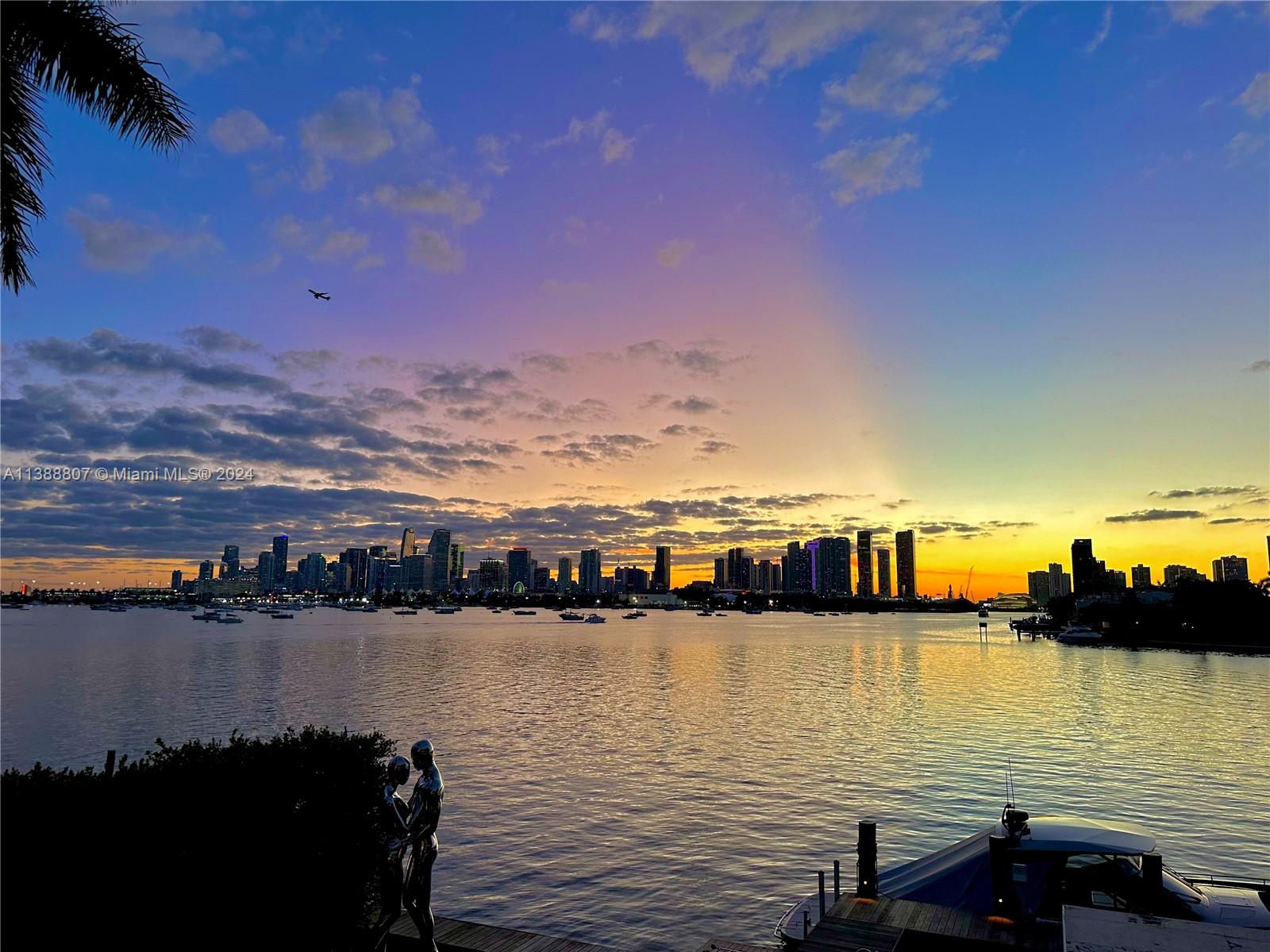 THE ULTIMATE POST CARD VIEW OF DOWNTOWN MIAMI SKYLINE ON THE BAY…THIS TROPICAL MODERN WATERFRONT ESTATE SITS ON THE BEST LOCATION OF SAN MARINO ISLAND! Stunning Two-Story Waterfront Residence w/ 9,005 Adj Gross SF on a LOT & A HALF at 15,750 SF with 90 FT of Waterfront. 5 Bedrooms + 5 Baths + 2 Powder Rooms + Media Room + Office + Family Room. Open Floorplan with 10 FT Telescopic Doors by Fleetwood providing Seamless Indoor/Outdoor Living. Blonde Oak Chef’s Eat-in Kitchen with Stainless Steel Miele Appliances, Breakfast Area + Family Room, Library, Wine Cellar & Bar. Spacious Primary Suite draped by Panoramic Sunsets & Views of Miami Skyline. Deep wraparound Balcony & Stairs Lead to Expansive Rooftop Entertaining Area. Tropical Pool & Spa with Modern Gazebo + Summer Kitchen + Cabana Bath.