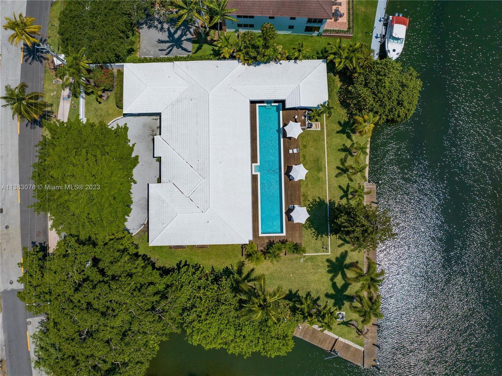 Coral Gables Waterway Home. Wide Canal frontage with 100’ Dock facing North, 40' Dock facing East, allowing the most enthusiastic Angler to dock his pride and Joy. Bridge clearance 12'-18' Height, 15 minutes to Intercoastal. A renovated home using the most selective materials such as Onyx, Quartz, Exquisite Marble, European Hardware, Quartz Kitchen Counter tops. Kitchen is for the Chef in mind, 4 Thermador Column Style Refrigerators, Freezers, and Wine station, two Separate Sink Stations, two separate Cooking Surfaces and Ovens, next to Kitchen Servants quarters. The kitchen leads to a Private Chef Table, seats 10. This 6 Bedrooms, 6 1/2 Bathrooms, Office, 2 Dining areas a great Grand Room overlooking a majestic pool, spacious green area and Waterways. Impact windows and doors
