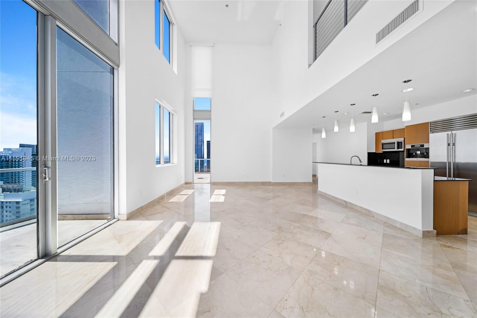 Escape to a contemporary Oasis of Luxury in this remarkable Penthouse at 1060 Brickell Ave Unit 4505. Boasting panoramic city and water views, this residence offers an unparalleled living experience. The four balconies (one on each bedroom and living room) provide an idyllic setting to enjoy the captivating vistas, while the double high ceilings in the living room and dining room create a sense of grandeur. Adorned with sleek marble floors, this penthouse exudes modern sophistication. Indulge in the harmonious blend of elegance and tranquility that this exceptional condo offers. Embrace the pinnacle of luxury living in this 2,525 Sq Ft under AC haven of elegance. Unit also includes the added benefit of two (2) parking spaces situated on the 2nd floor located conveniently by the elevator.