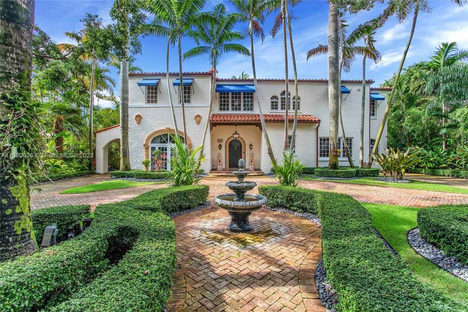 Majestic Mediterranean mansion on Coral Way. Grand foyer leads to large gracious spaces; living room w/fireplace,library/office w/gas fireplace, dining room, and family room w/bar. Main floor features guest room and staff room, each w/bath, cook's kitchen, breakfast room, and wine cellar. Impact glass French doors open to wide covered terrace w/entertaining area. On the 2nd floor: primary bedroom with massive bath and 2 walk-in closets; two other bedrooms each with private bath. Home was renovated in 2006 preserving the Old Spanish look and charm w/wood, marble, and tile floors, beamed ceilings and original stained glass. Pool area features a cabana w/bath, steam room, and a 2nd wine cellar (possible guest cottage). Impact glass throughout, roof and ACs new in 2022.