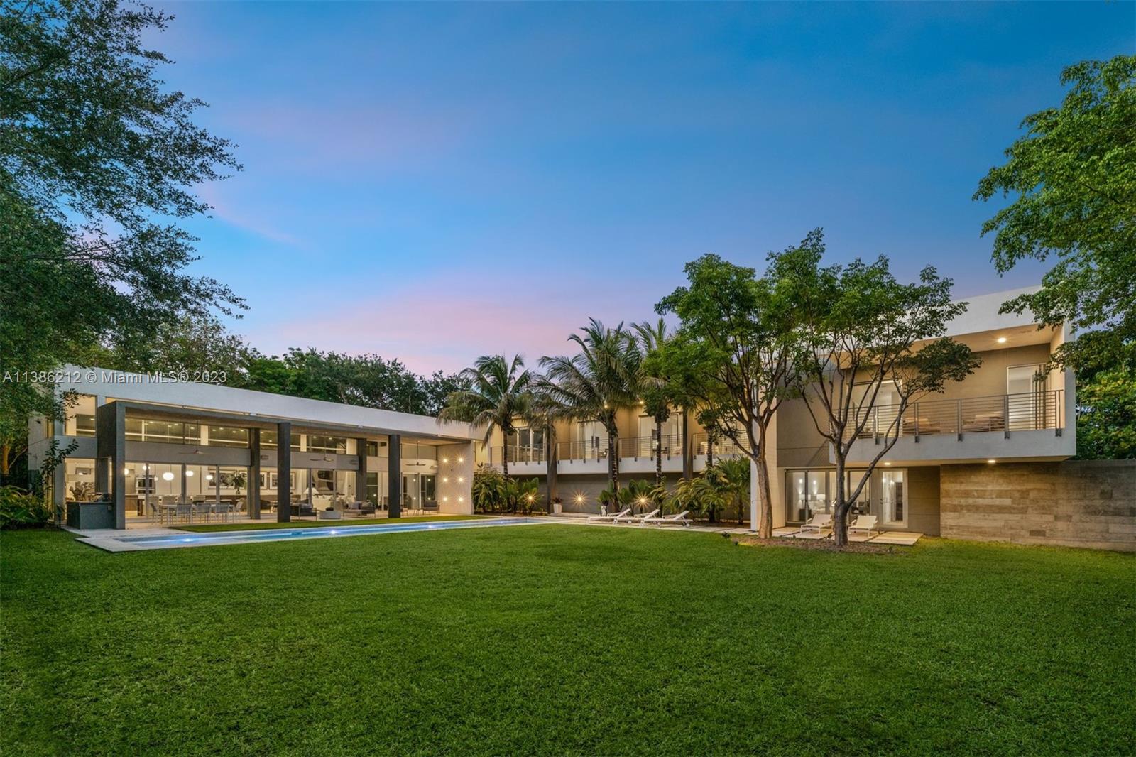 Nestled on a builder’s acre on a corner lot in Pinecrest, this 2-story Modern residence was thoughtfully crafted and designed by award winning architect Roney Mateu. Sky-high floor-to-ceiling windows offer an open and airy elegance throughout the living spaces. Custom Berloni Kitchen with cooking island, and Thermador appliances. Additional Family Room located on the second floor. Primary Room features a private balcony, 2 built-out walk-in closets, and spacious spa-like bathroom. Mature oaks provides a perfect private oasis for the ultimate retreat.  Additional features include Home Automation System, sauna, heated pool, basketball court, large covered terrace with summer kitchen, and 3 car garage. Located minutes from A+ rated schools, eateries, and shops.