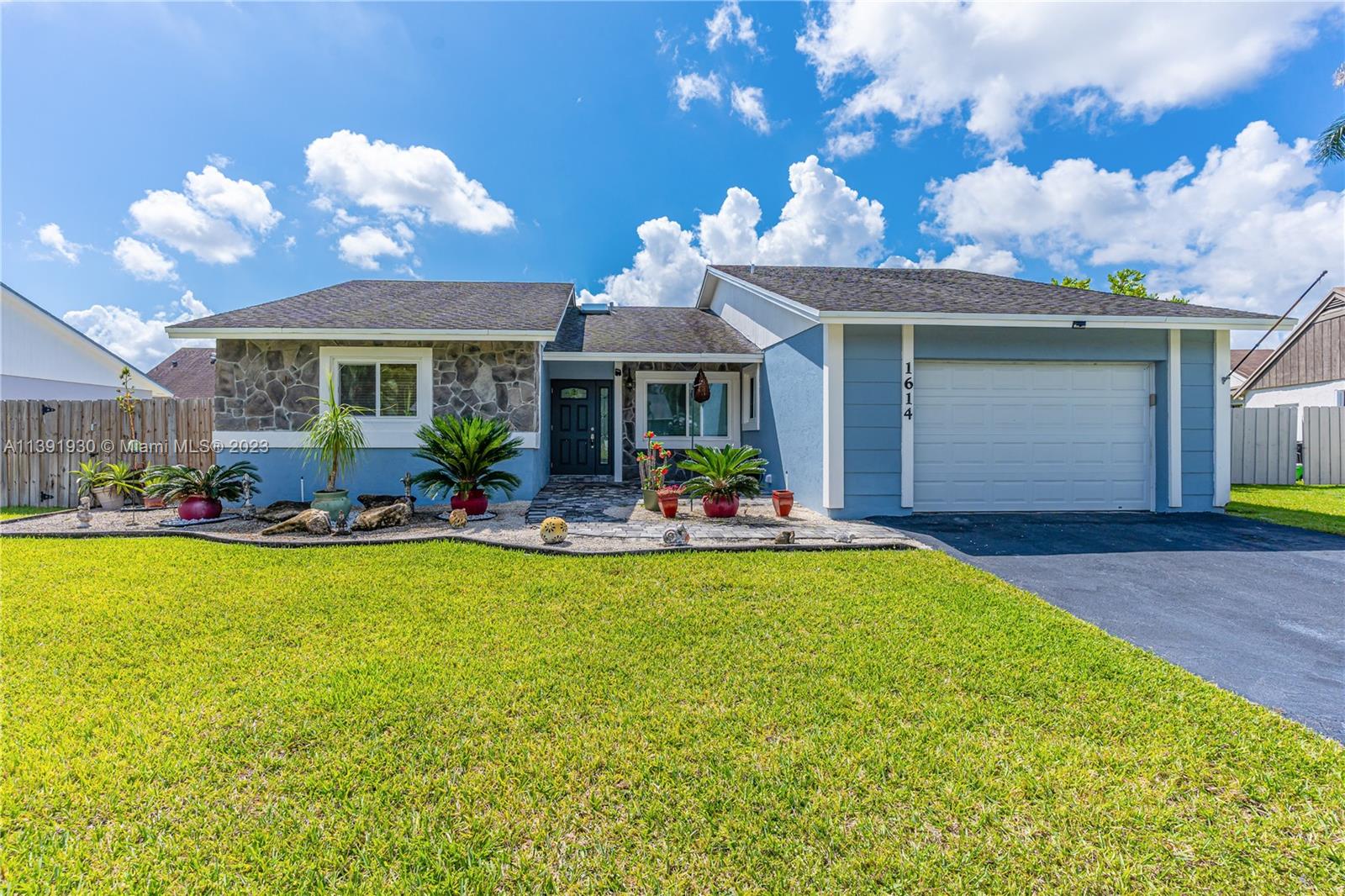 Beautiful one story family home with 8,710 square feet of land. Features: beautiful outdoor landscaping, 3 bedrooms, 2 bathrooms, 2-car garage, open floor plan connecting the formal living and dining area leading to the oversized family room. Impact glass windows throughout, ample CHEF kitchen with built in cabinets. Gas stove with hood, stainless steel appliances, huge master bedroom, bright spotlights, covered outdoor patio, room for pool & provides an ideal setting for family gatherings right in your private back yard. Space for RV and boat. Enjoy living on a quiet street with easy access to restaurants, shopping, turnpike, and entertainment venues. Excellent schools, The Keys Outlet Mall & park.  Community offers resort-style amenities: pool, clubhouse, basketball & tennis courts.