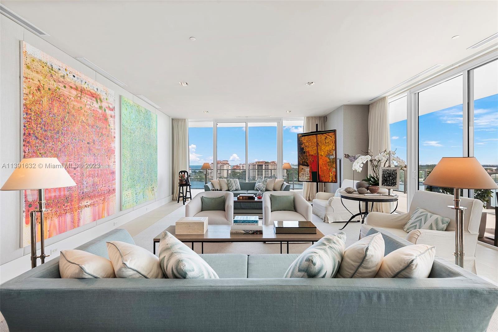 Rarely available '04 line corner unit. Sleek, sophisticated, and contemporary at the exclusive Apogee South Beach. Designed by world-renowned Designer Luis Bustamante. Spacious and bright 4 bedrooms & 3.5 baths with 4154 sq. ft of living space. Expansive wrap around 2441 sq. ft balcony. Designer finishings, 10' ceilings, private elevator foyer, summer kitchen, media room, Private 2 car enclosed garage with A/C  included.  Stunning views of cruise ship alley, Fisher Island, and the city.