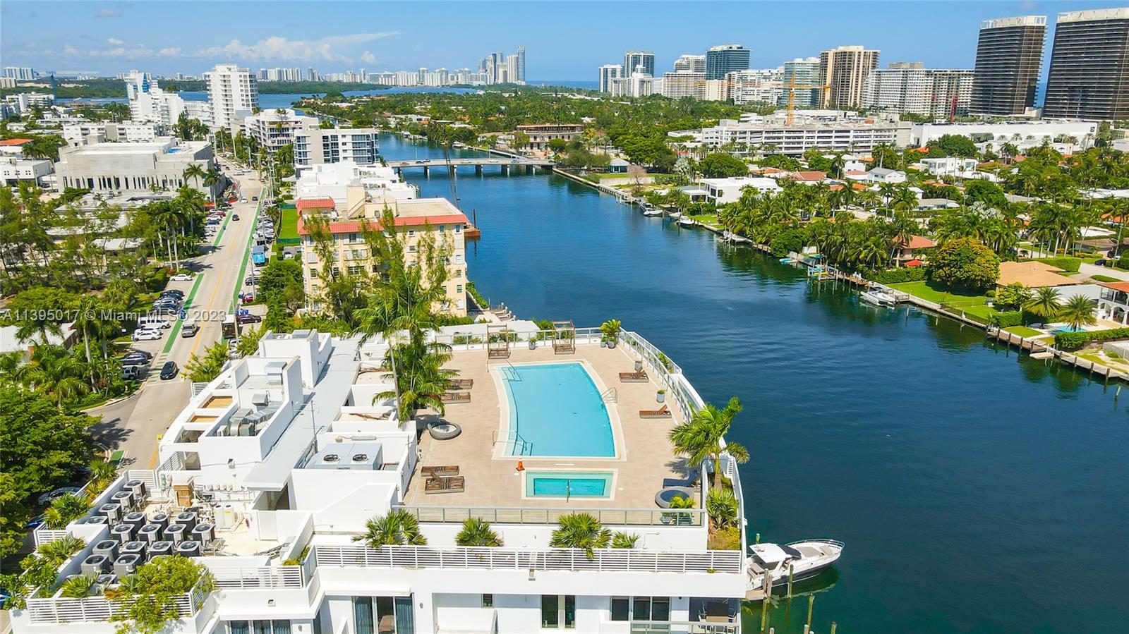A luxury fully furnished designer-decorated unit, READY TO MOVE-IN. Ivory is a newer boutique building in the sophisticated Bay Harbor Islands, with a rooftop pool overlooking the ocean. Perfect as 2nd home or investment property; building allows shorter terms. Partial water views, featuring modern high-end furniture/finishes, wood tile throughout, closets and lots of built-in/upgrades. Spacious floor plan with 2bed + large den with window (converted to 3rd bed) with 1,305 sqft of living area + 400 sqft of large balconies. 2 assigned parking spaces + storage. This is one of the most sought-after areas in Miami, just a few minutes away from beach, A-rated public school, Bal Harbour mall and trendy restaurants. New luxury development under construction next to the building.