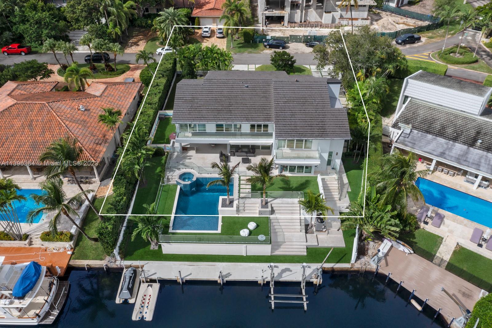 Located on a prestigious & desired Gated community of Sunrise Harbour in Coral Gables with 100 feet of water frontage and dock, direct access to Biscayne Bay, this luxurious modern waterfront residence has been fully renovated for living a contemporary and luxurious lifestyle with no expenses spared and high-end finishes throughout, featuring a spacious living room boasting 25 ft ceilings. Six large bedrooms, gym spaces, a playground, and an office. The chef’s kitchen is equipped with a suite of advanced Wolf appliances, closets have been custom-designed, and a large laundry room offers more than ample storage spacious gourmet kitchen, a glass wine room & bar, storage, 2 car garage, and more. Premium location minutes from the Grove, South Miami, great schools, and the Miami airport.