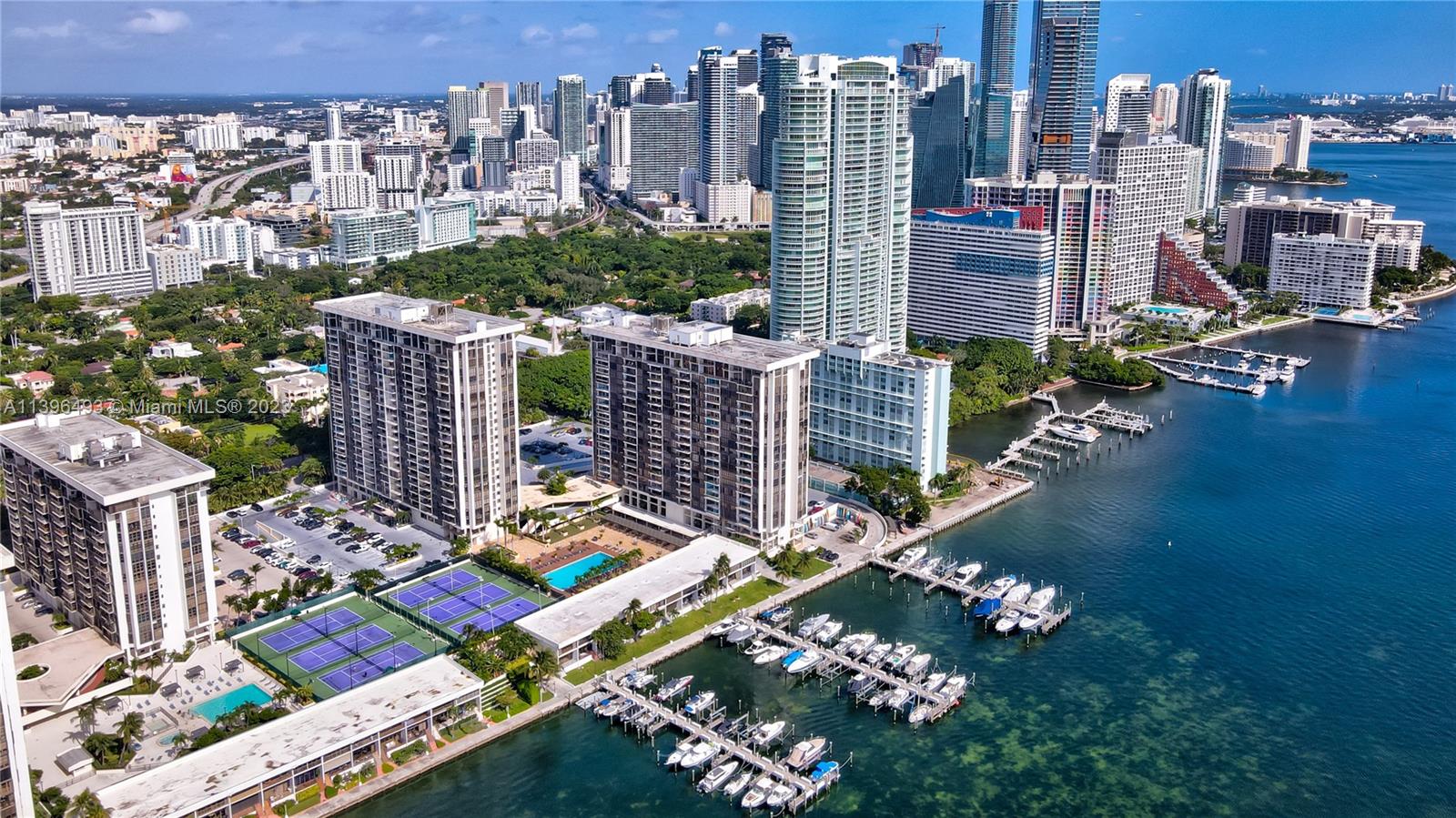 Spacious large 1 bedroom, 1.5 baths with views of Miami's Skyline and Bay. Washer-Dryer inside unit updated. Assigned covered parking space. Amenities include Tennis court, pools, gyms, BBQ area, play area for kids and much more! Gated community with 24 hour security and valet parking for visitors, centrally located. Wood floors throughout. Gourmet kitchen w/ stainless steel appliances and granite counter tops, microwave, wine cooler and more! Vacant and easy to show. A must see! Special assessment of $275 per month with approx 81 months to pay in full for ongoing 40 year certification work .