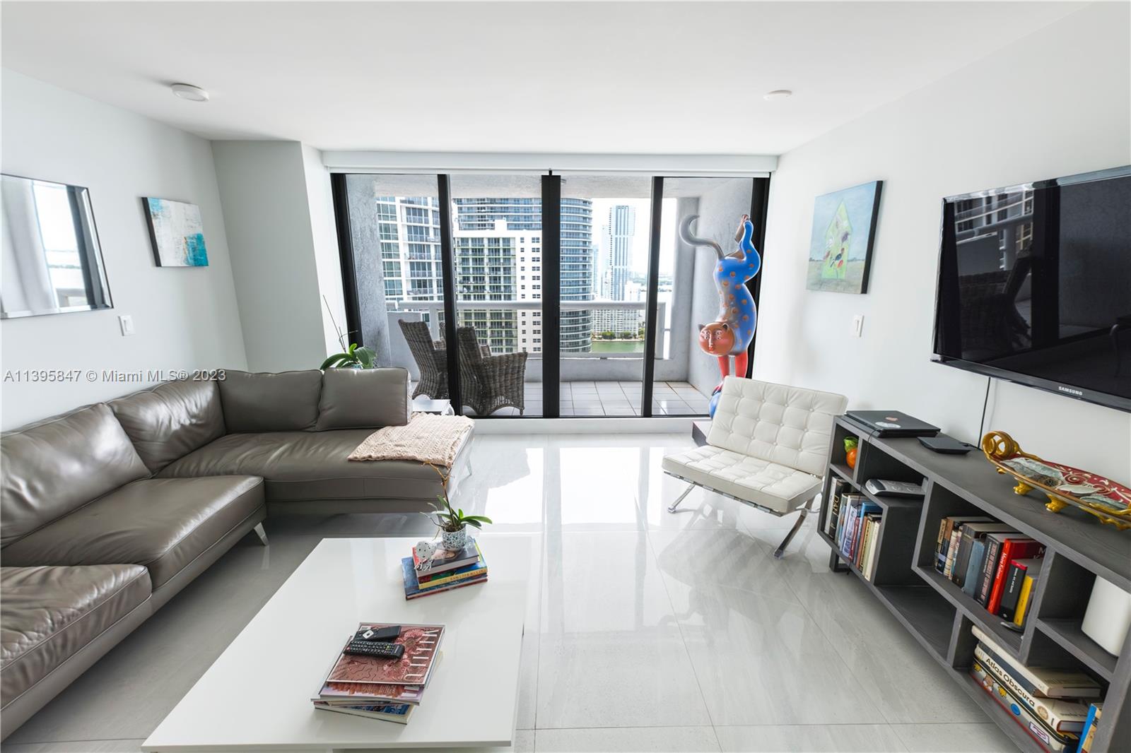 This beautiful condo at The Grand, a full-service building with restaurants and shops, features 2 bedrooms plus a den that has been converted into a 3rd bedroom, providing extra space for guests or a home office. Impact windows, an upgraded kitchen with granite countertops, and a recently renovated master bathroom and flooring make this a remarkable opportunity to own a residence with incredible views of Biscayne Bay, the Atlantic Ocean, and the Miami skyline. The building is located next to Margaret Pace Park, and just minutes from Brickell, South Beach, Design District, and more, enjoy the convenience of urban living while immersing yourself in the tranquility and natural beauty of the park.
