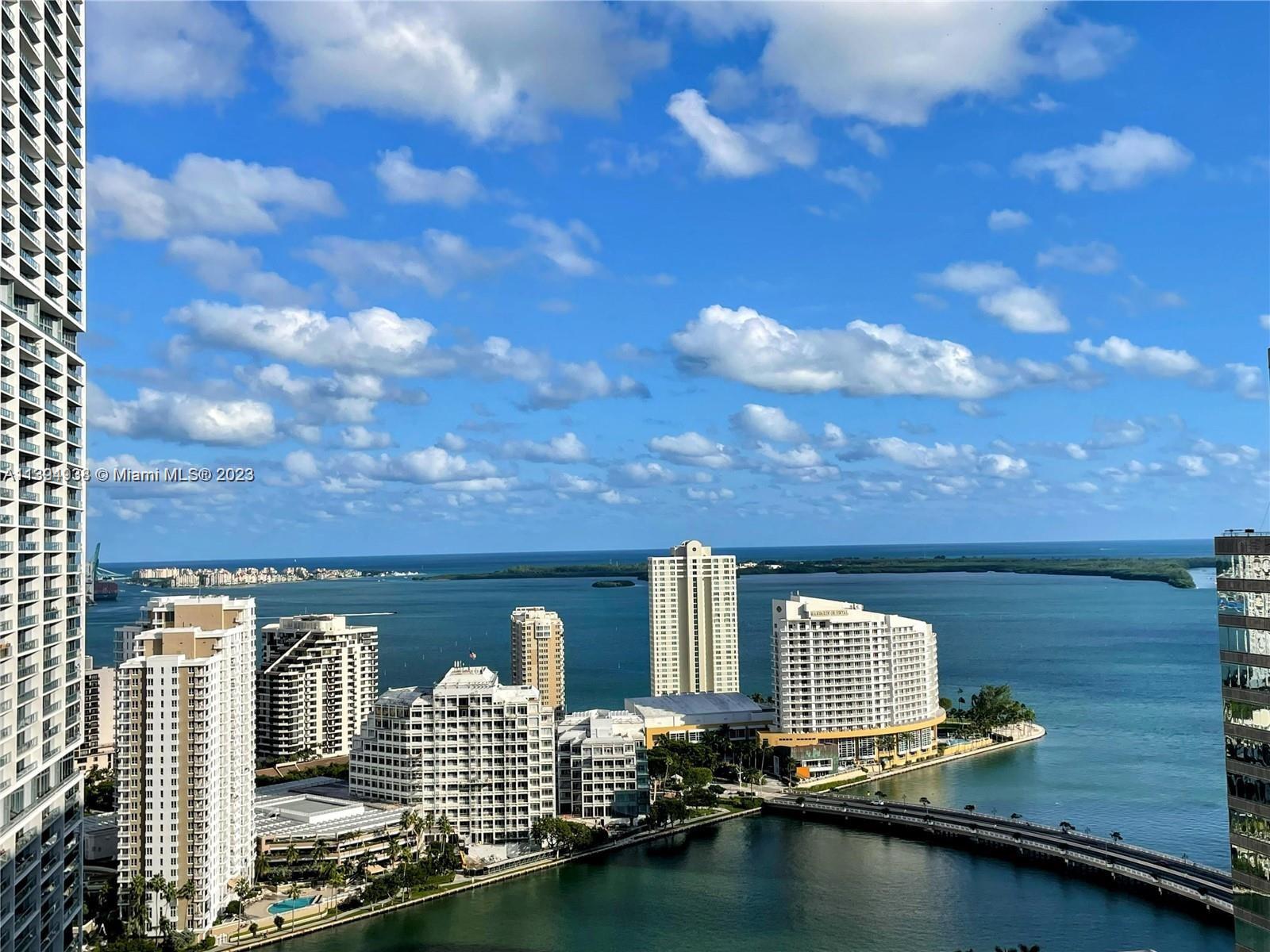 FULLY FURNISHED. Direct water view! Spacious 1 bedroom + Den/Office - Large and Private balcony with unobstructed panoramic water views and city skyline. Ample master bedroom with spacious walking closets - European style kitchen fully equipped with GE monogram appliances, A Full-Service Building with Unmatched 5 Star Resort Style Amenities - 2 swimming pools, gym, Spa, Jacuzzi tub, theater room, 1 parking space, valet, security, footsteps from the best in Brickell. A must-see property!