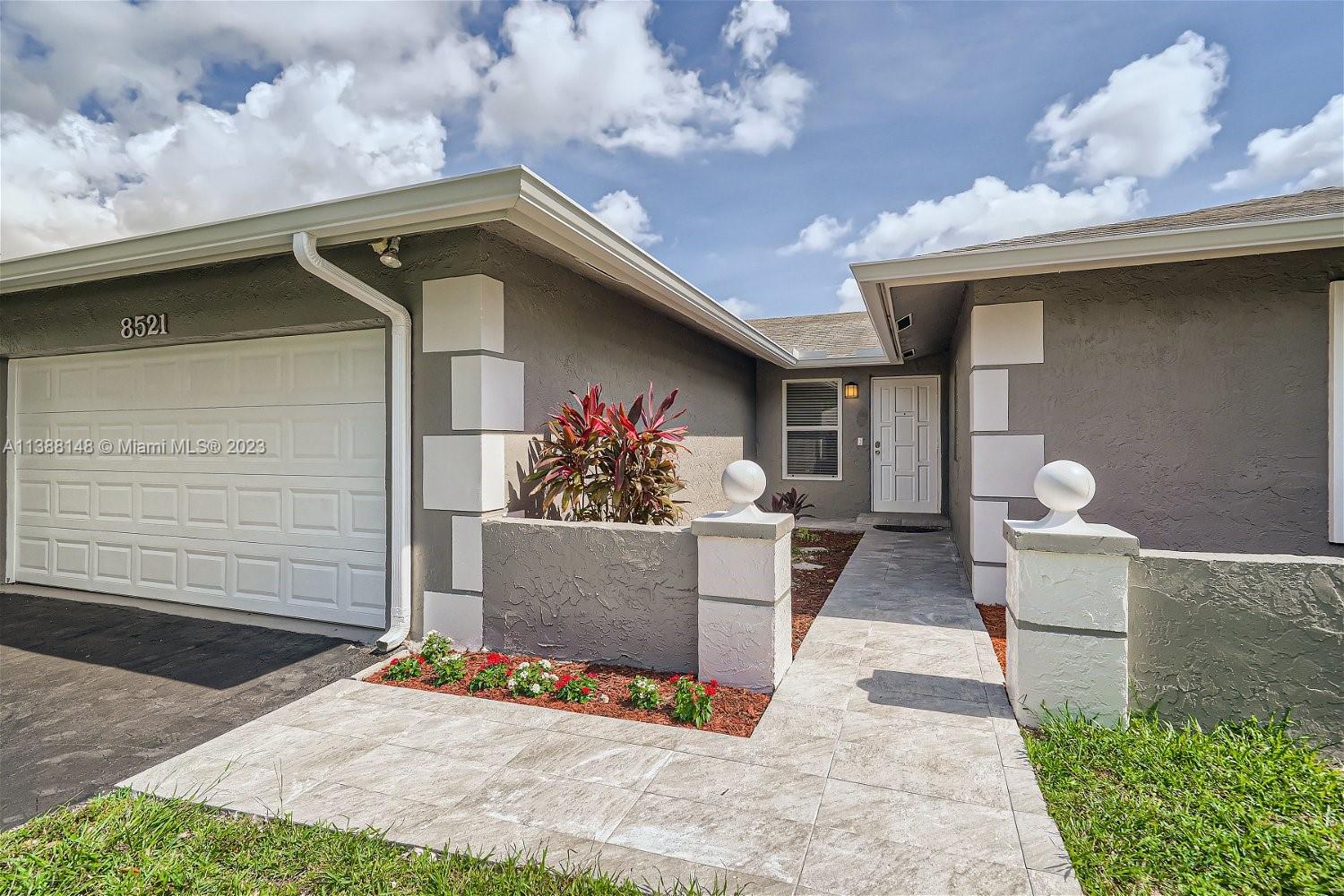 Welcome to this beautiful pool home, nestled in the highly desired City of Palmetto Bay. This lovely home boasts 4BRMS/2BTHS, a 2-car garage and circular driveway. Just renovated kitchen, features modern cabinets with quartz countertops and new stainless-steel appliances, while the bathrooms showcase modern cabinets and quartz counter tops. The home is equipped with ceiling and impact windows. French doors lead to the spacious outdoors where the covered pool and patio area provide ample space for all your family's entertaining needs. This excellent, A-rated school district ensures that your children receive the best education possible. Unbeatable location, in close proximity to parks, restaurants, and shopping.  Don’t miss out on the opportunity to make this amazing home your forever home!