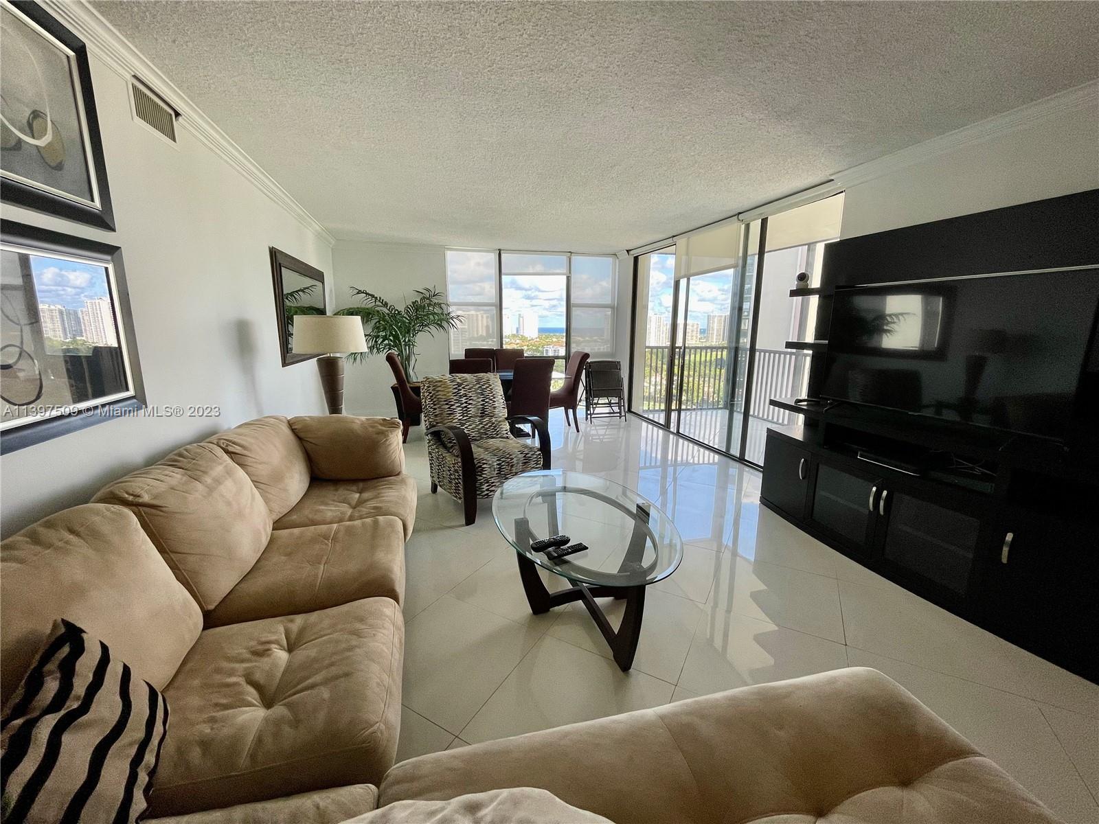 2/2 renovated and fully furnished corner condo with panoramic views of the Turnberry Golf Course and ocean views from the 20th Floor. Spacious unit with over 1300 sq ft with plenty of natural light natural light.  One covered assigned parking, cable TV & internet included by HOA, pool, spa, jacuzzi, gated community, excellent school district, walking distance to Aventura Mall and 5 minute drive to the beach.  There is also a Free Aventura shuttle available. 2 YEARS LEASE REQUIRED BY THE ASSOCIATION.