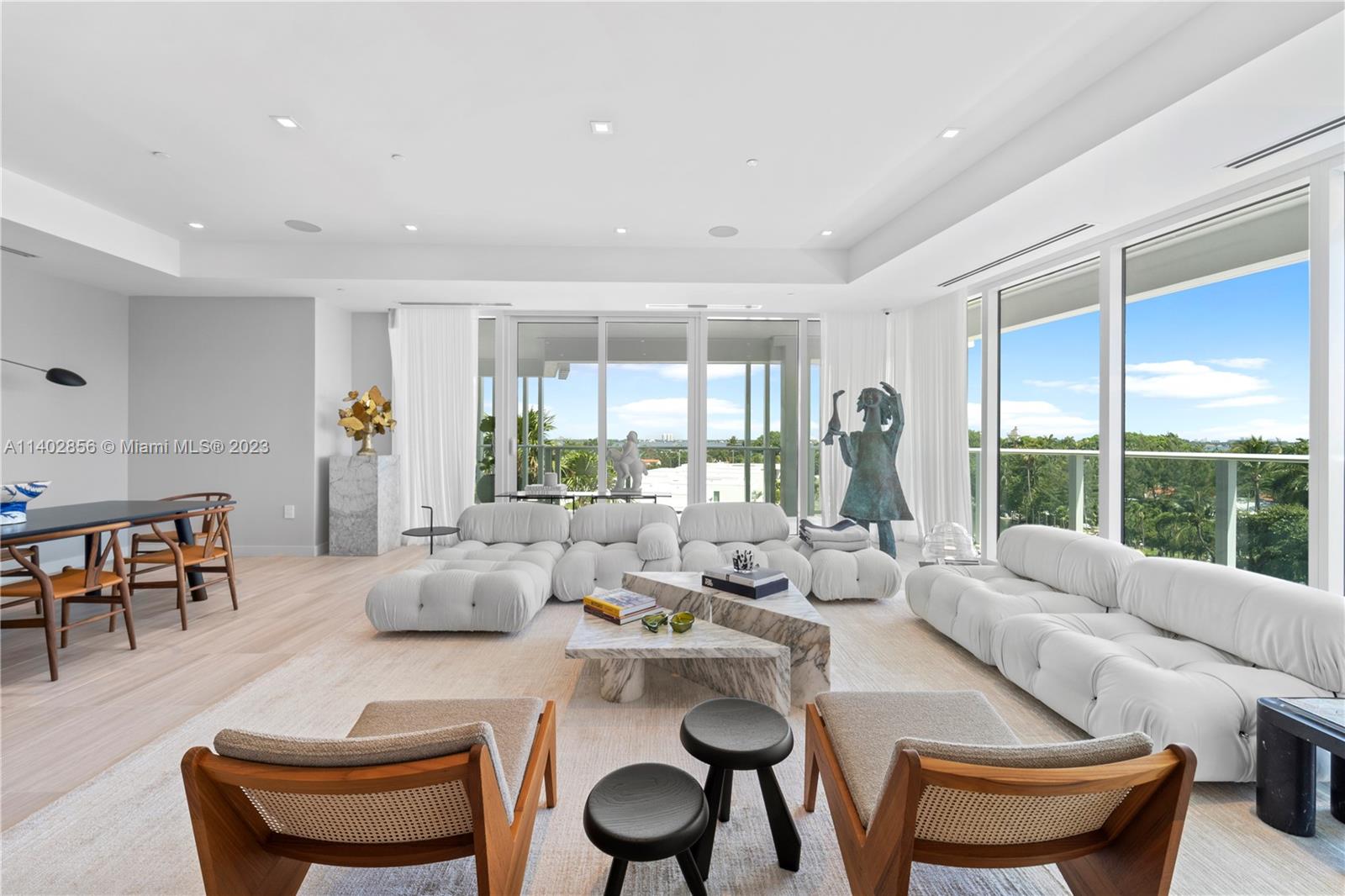 Exquisite Estate waterfront living while enjoying the Ritz Carlton. BOAT SLIP included for a 40' Dock. Unit has unobstructed water views!!! Renovated with luxurious modern features. Boffi design in bathrooms & kitchen. Gaggenau appliances, gas range & 140 wine cooler. Spacious unit has 3B + Enclosed Den & 3.5B. Master bathroom was redone with herringbone patterns making it unique. Ceilings 9' to 10' high. Private elevator. Unit includes .  Amenities include in-house car & yacht. Rooftop Pool Deck & Spa, Art Studio, Theater, Playroom, Valet Parking & more. Turnkey. Easy, sophisticated, wise, peaceful. A simple choice from morning to night to enjoy the finer things in life. CAR ENTHUSIASTS we have 6 parking's (2 private garages for 4 cars) plus 2 regular parking's.