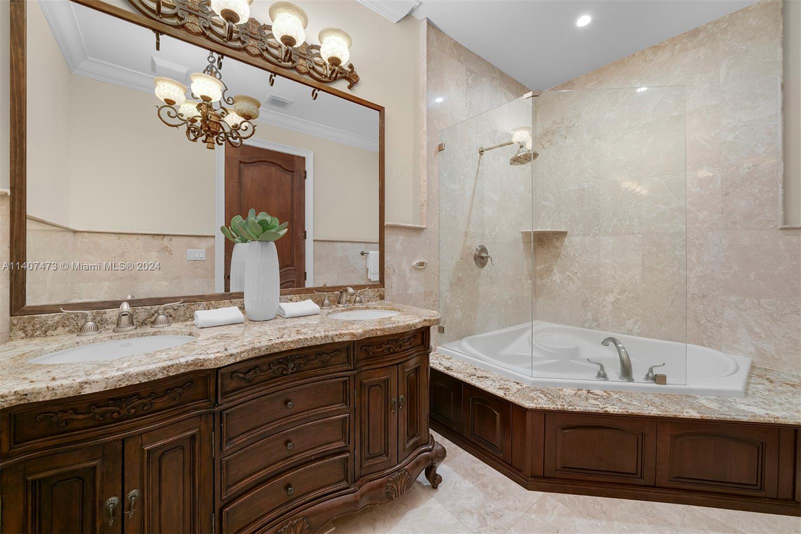 Elegant & Exquisite estate located in Pinecrest, enveloped by pristine landscaping & private gates. Completely renovated in 2013, this property offers volume ceilings, a grand foyer w/ an elegant staircase, & expansive living areas for entertaining. Discover 6 bedrms, 7/2 bathrms, + two lofts/playrm, home theatre, & recreational rm w/ a custom wet bar & wine cellar. Enjoy a gourmet kitchen w/ butler’s pantry, breakfast area & large family rm to enhance the experience. The master suite impresses w/ a sitting room, spa-like bath w/ a gas fireplace, & a private terrace w/ staircase overlooking the outdoor oasis. Outdoor living is exceptional w/ a covered terrace, summer kitchen, pool/spa, ample grounds, and a half basketball court. Add’l features: impact win/drs, a 3-car gar, & generator.