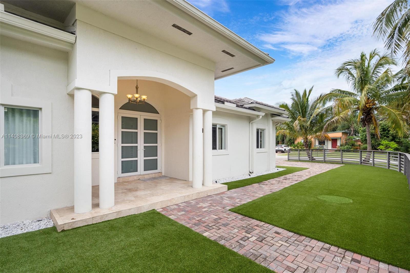 Stunningly remodeled 5/4 home in South Miami. Boasting 3225 adjusted area, this open floorplan offers hi ceilings and abundant natural light. Beautiful gourmet kitchen and huge laundry room are perfect for modern living.Enjoy new closets,fence & outdoor lighting. Feel safe w/ alarm & sec cameras. Great big patio with kids' playground and synthetic turf awaits you, along with a renovated pool featuring new plaster, tile & heater. Relax under a pergola amidst the recently done landscaping. New roof filling, insulation & Gas connection provide added convenience. Entertainers paradise.Prime location, just 5 min to Dante Fascell Park, restaurants, shopping, top schools, Trader Joe's, and Dadeland. Plans and permits included for a 370sqft extension. Don't miss out on this incredible opportunity!