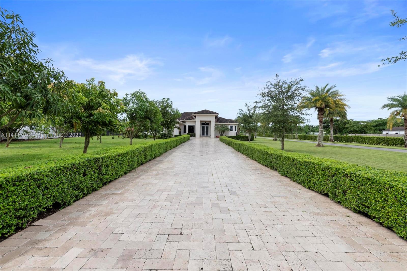 First Class Equestrian Estate in Redland built in 2016. 3,690 Sqft home on 2.42 Acres w/ Guest house. No expense spared from the smart house to the stable area. Spacious master suite, 3 Beds/3.5 Baths. Too many custom upgrades to include here, open floor plan, gourmet kitchen w/ high end kitchen appliances, quartz counters, island, high end cabinetry, custom closets. Quality surround sound system, brand new sec system W/ CCTV and 23 surveillance cams, exterior lighting, impact windows and doors, full power generator, new water softener, resort style heated pool w/ Jacuzzi waterfall, 3 wells, 2 driveways, 2 electric gate, horse stables, 4 stalls each w/their owned sanded paddocks, fans & spray system, green grass/sand arena. Fully fenced w/lush landscaping. Seller will entertain all offers!