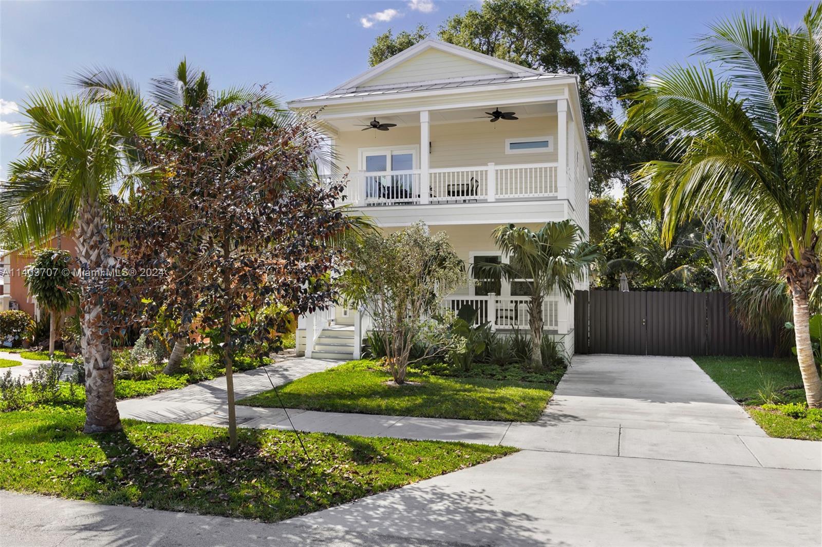 Captivating, Key West style new construction home on quiet, tree-lined street. Walk or bike to downtown Coconut Grove’s trendy galleries, boutiques, cafes and bayfront parks & marinas. A welcoming front porch leads into light-filled living spaces with volume ceilings, an open floorplan and wide plank wood flooring. Classic kitchen features white wood cabinetry, stainless appliances, quartz countertops & a breakfast bar. 4BR’s/3.5’s including: 1st level full guest suite + powder room + laundry room. 2nd level: large master suite opens to a private covered porch and has a walk-in closet & classic-style bath w/oversized shower. Impact glass throughout. Close to Coral Gables shopping & fine dining in Coral Gables and just minutes to downtown Miami, Key Biscayne and the Beaches.