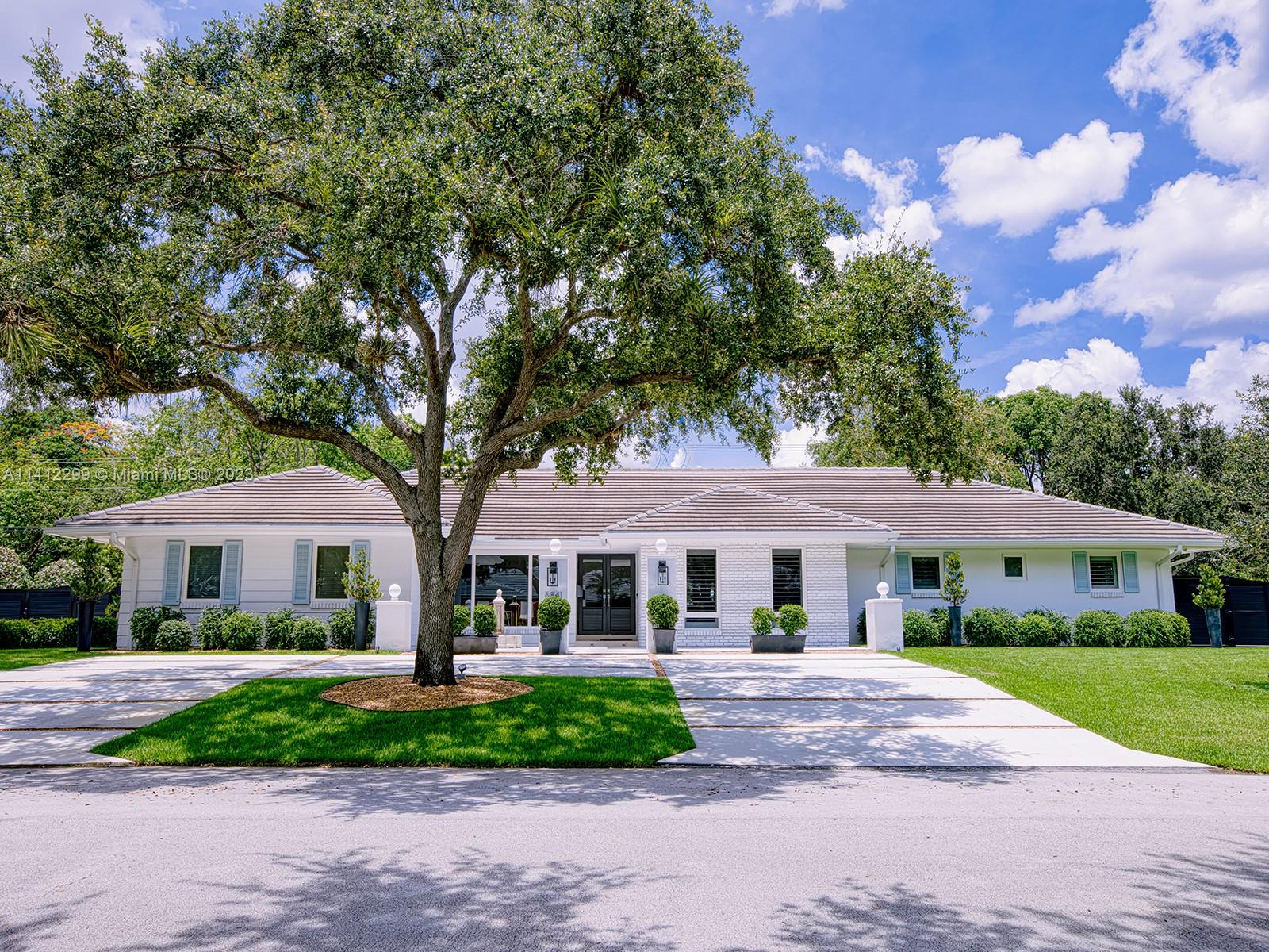 Florida contemporary classic and a destination worthy of extraordinary; recently refinished in 2022. A 7 bed/4 bath Miami home that blends nature’s beauty w/ new architecture. Welcome to this private residence, located on 6841 SW 144 Terrace, bearing an imitable facade (including new driveway w/ floor spotlights). Immediately upon entering, residents will find an entry courtyard fit w/ checkered patterned floors and fountain. The interior features a gracious living space, den, and dining room; detailed w/ European white oak floors/herringbone design. The gourmet chef’s kitchen offers perfect luxury w/ spacious island (seating 8), ultramodern appliances, and wine cooler. The highlight is the designer backyard, complete w/ pool, jacuzzi, and cabana bath. Extra: 7-zone built-in sound system.
