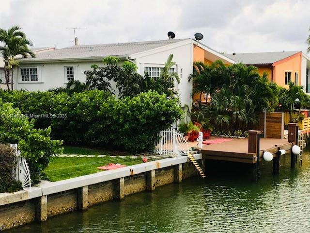 *Neighboring waterfront lot included in sale for over 80 feet of available seawall & 2 boat slips!* Boater’s paradise. This spectacular updated 3 bed, 2 & 1/2 bath waterfront townhome is being offered with a 30 ft. dock w/boat slip, kayak launch, & has open bay access w/no fixed bridges. Featuring incredible views w/unmatched privacy and serenity. The sophisticated interior design w/large format porcelain floors downstairs & bamboo upstairs, open designer kitchen, & separate laundry room. Ideally situated walking distance to the beach, great restaurants & shops and minutes from Bal Harbour Shops, houses of worship & more. There is nothing like this in all of Miami Beach- waterfront townhome w/no fees, expansive waterfront w/dock & no fixed bridges to ocean & huge private yard/garden.