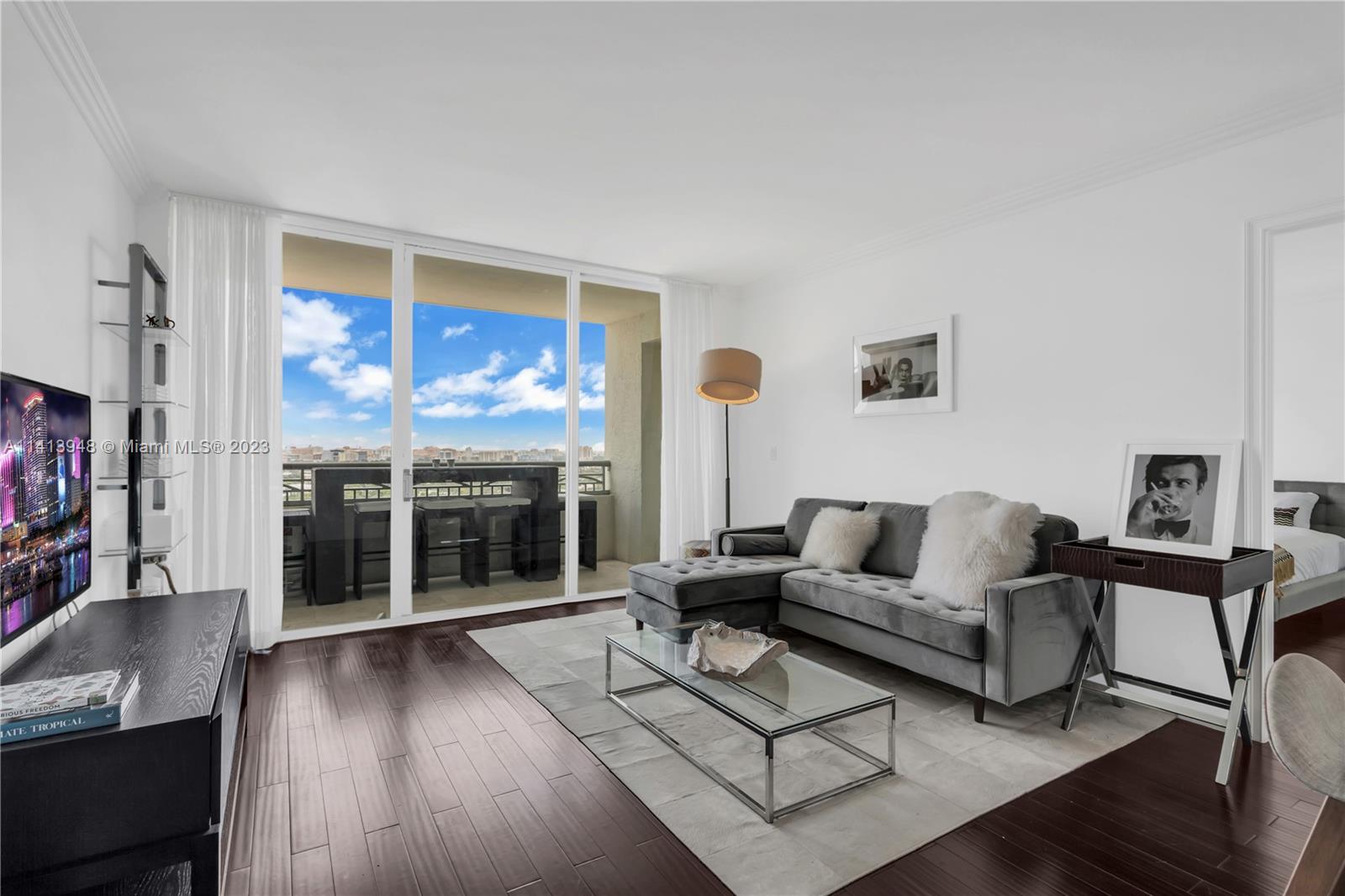 This spacious 1 Bed, 1.5 Bath is located on the 19th floor in the ultra-luxury Ritz-Carlton Coconut Grove. This unit features granite countertops, stainless steel appliances, custom closets, and a bright open floor plan. The modern kitchen with a breakfast counter overlooks spectacular views of Coral Gables. Step outside to your large balcony with designer furnishings that provides indoor-outdoor access and light throughout the unit. The spa-like master bathroom includes a frameless glass shower and top-of-the-line finishes. Property amenities include fingerprint entry, 24-hour concierge, private pool, fitness center, in-room dining, 3 world-class restaurants, and The Ritz-Carlton Spa on site.