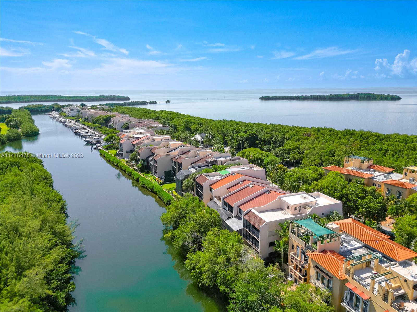 Imagine yourself surrounded by water in a Beautifully Landscaped Island Townhouse. At the Southern Tip of the Gables Waterway Sits a Rarely Available Townhome Which is 1 of the 2 Biggest Townhomes in Royal Harbour w/Almost 6000 Sq Ft of Living Space. Home Features 5 Bed, 4.5 Baths, High Ceilings, Newly Remodeled Kitchen w/SS Appl, Elevator, Rooftop Terrace, 2 Car Garage & Partial Impact Windows & Doors. The Huge Roof Top Terrace is Ideal for Entertaining & the Backyard is Great for Watching the Manatees & Dolphins Swim By. As a Private Community, Royal Harbour Boasts Private Security, 2 Tennis Courts (1 doubles as a Pickle Ball Court), Clubhouse, Heated Pool/Spa, Gym, Beach w/Volleyball Court, a Nature Walk Pier to Bay & Marina w/No Bridges to Bay. This is Resort Style Living at its Best.