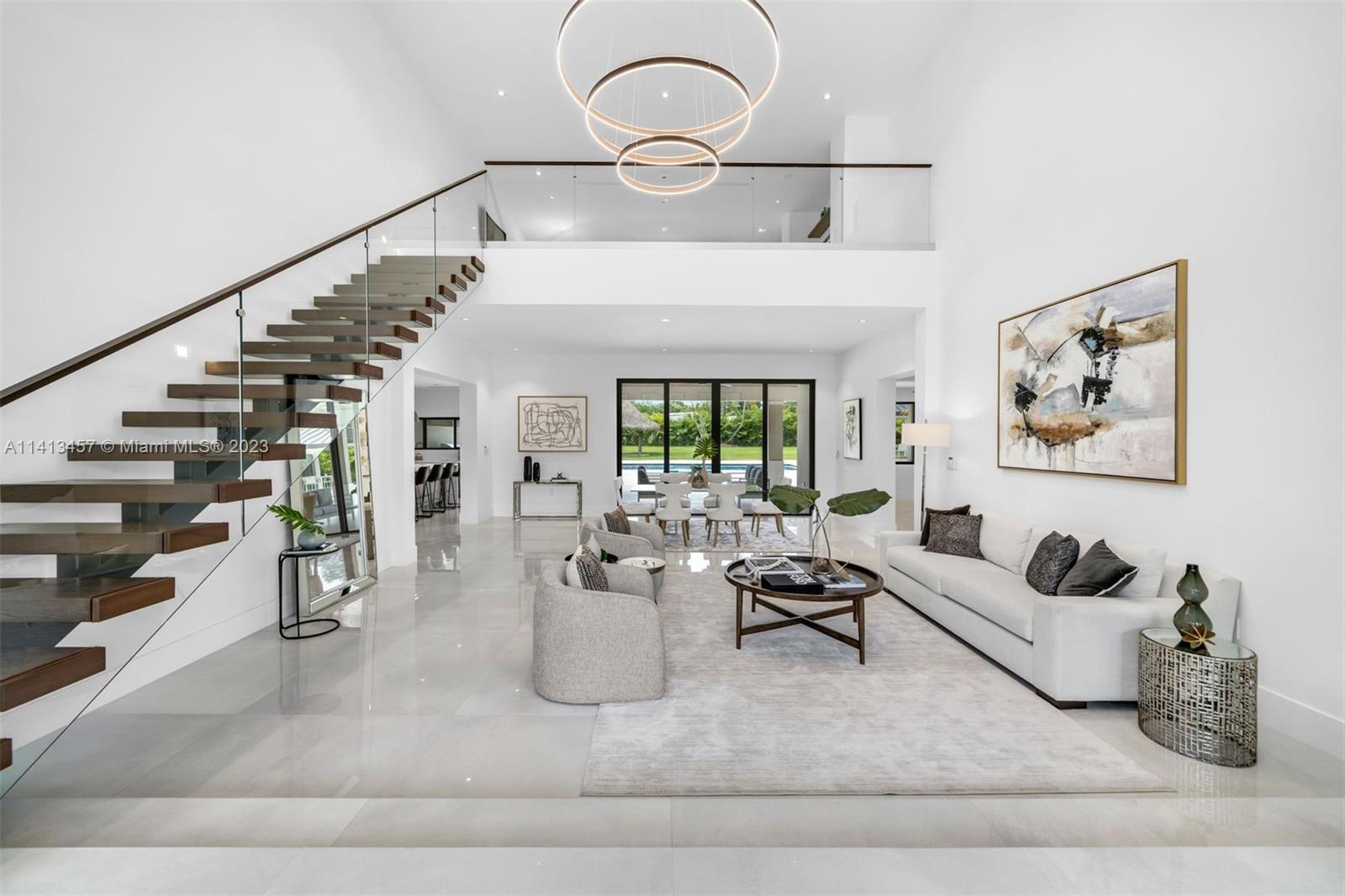 Indulge in luxury living at this meticulously remodeled 5-bed, 5-bath home. As you step inside, a grand 25-ft foyer welcomes you, setting the tone for the elegant atmosphere throughout. Every aspect of this home has been thoughtfully upgraded, seamlessly blending warmth and modern design. All bedrooms are on the main floor with a separate lounge/den upstairs. Impressive features include all new Thermador appliances, smart home functionality including Lutron lighting + savant home automation, a new metal roof, high impact windows + doors, soundproof interior walls, security cameras and a sound system throughout. Set on a 1-acre lot, the backyard is an oasis complete with a summer kitchen, gazebo, tiki hut and heated pool + spa. This home is a gem, exuding sophistication around every corner.