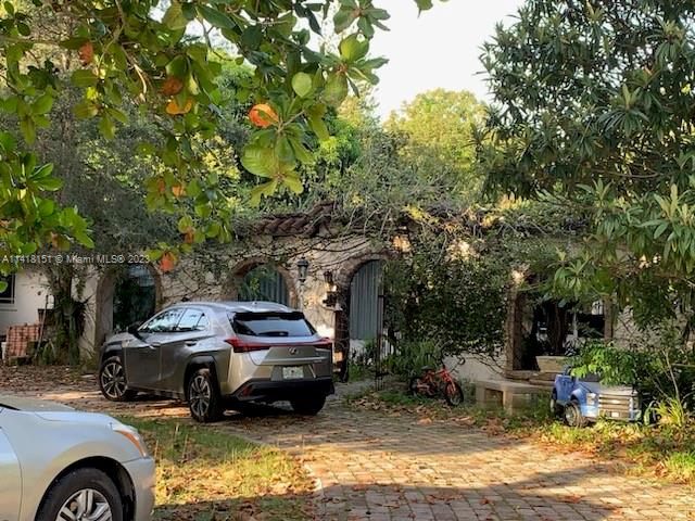 Much desired location! Property is selling for land value, over an acre lot.   Main house and guest house need total redo.
Build your dream home!
