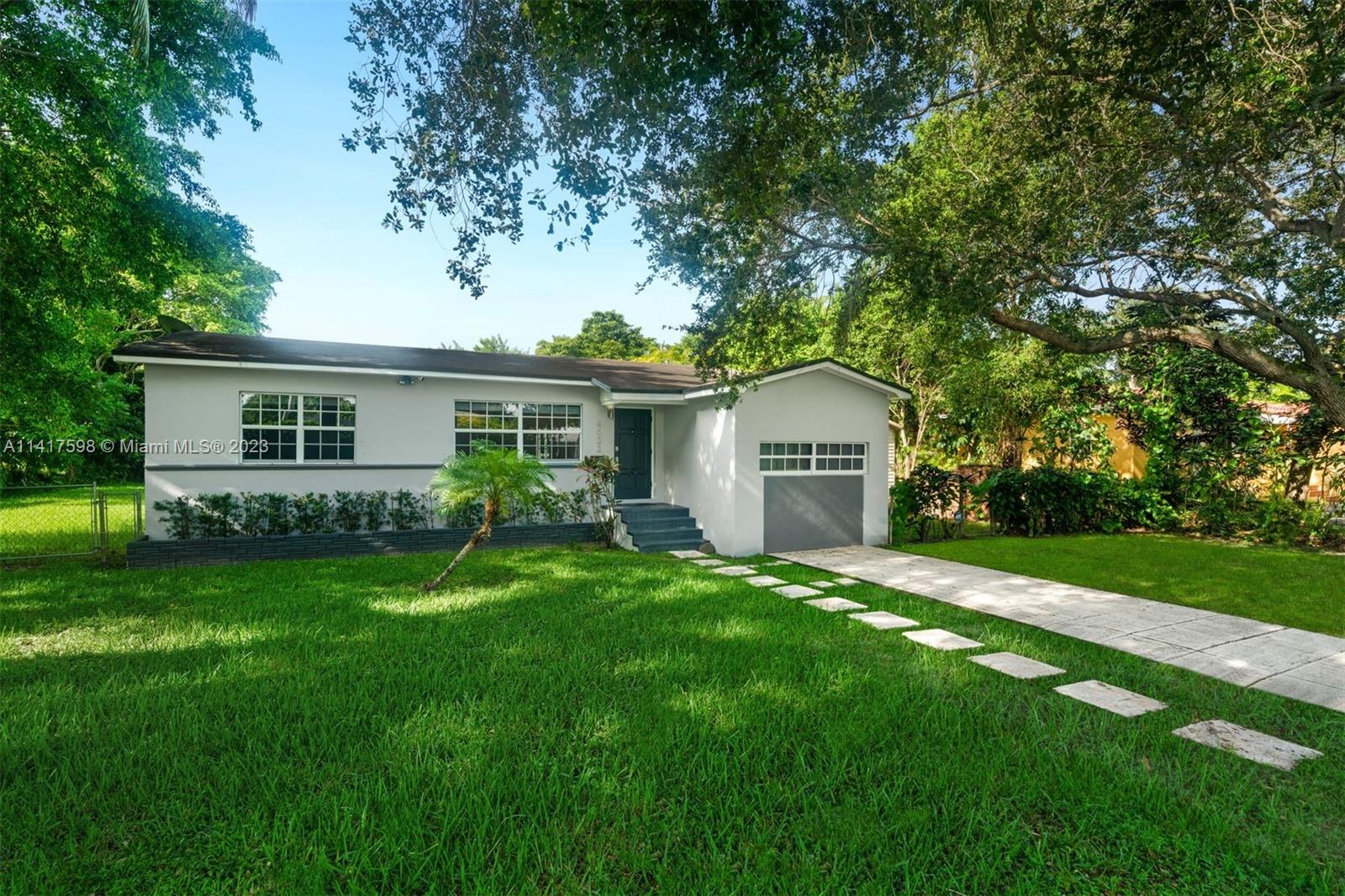 Charming and recently updated 1,414 sq ft, 3-bedroom 2-bathroom home on a 15,120 sq ft lot in South Miami. The home includes  wood floors throughout, a light-filled living area, a kitchen with modern Kitchen Aid, Bosch and GE appliances, and a cozy integrated dining space. The bedrooms are comfortable and bright, and the bathrooms have contemporary fixtures. Outside, a lovely porch and expansive backyard with lush landscaping provides a serene retreat, perfect for relaxation or entertaining. Conveniently located near top rated schools, parks, and shopping centers, this home offers unique advantages and comfort for the discerning buyer.