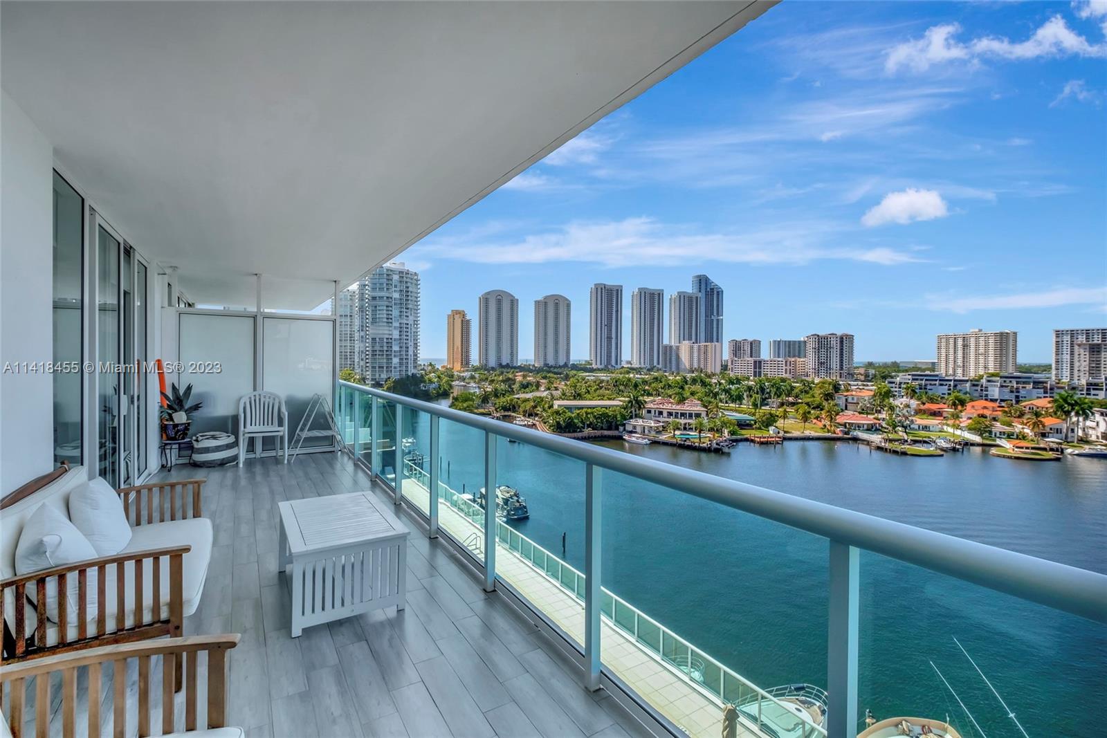 Experience luxurious waterfront living at 400 Sunny Isles Boulevard #907! This unique, two-story duplex offers two en-suite bedrooms + a den, three bathrooms, and 1,710 square feet of elegantly designed space. Enjoy panoramic water views from East to West, encompassing both downtown Miami and Miami Beach in the distance. The modern kitchen comes complete with a cooking island and porcelain floors, while the master bathroom includes a Roman tub. Amenities for the complex include a wellness spa, two gyms, tennis courts, an infinity pool, and a full-service dock. The building has a doorman, and offers valet parking (this unit comes with two spaces). Indulge in the epitome of luxury living at 400 Sunny Isles Boulevard and schedule a private tour today!